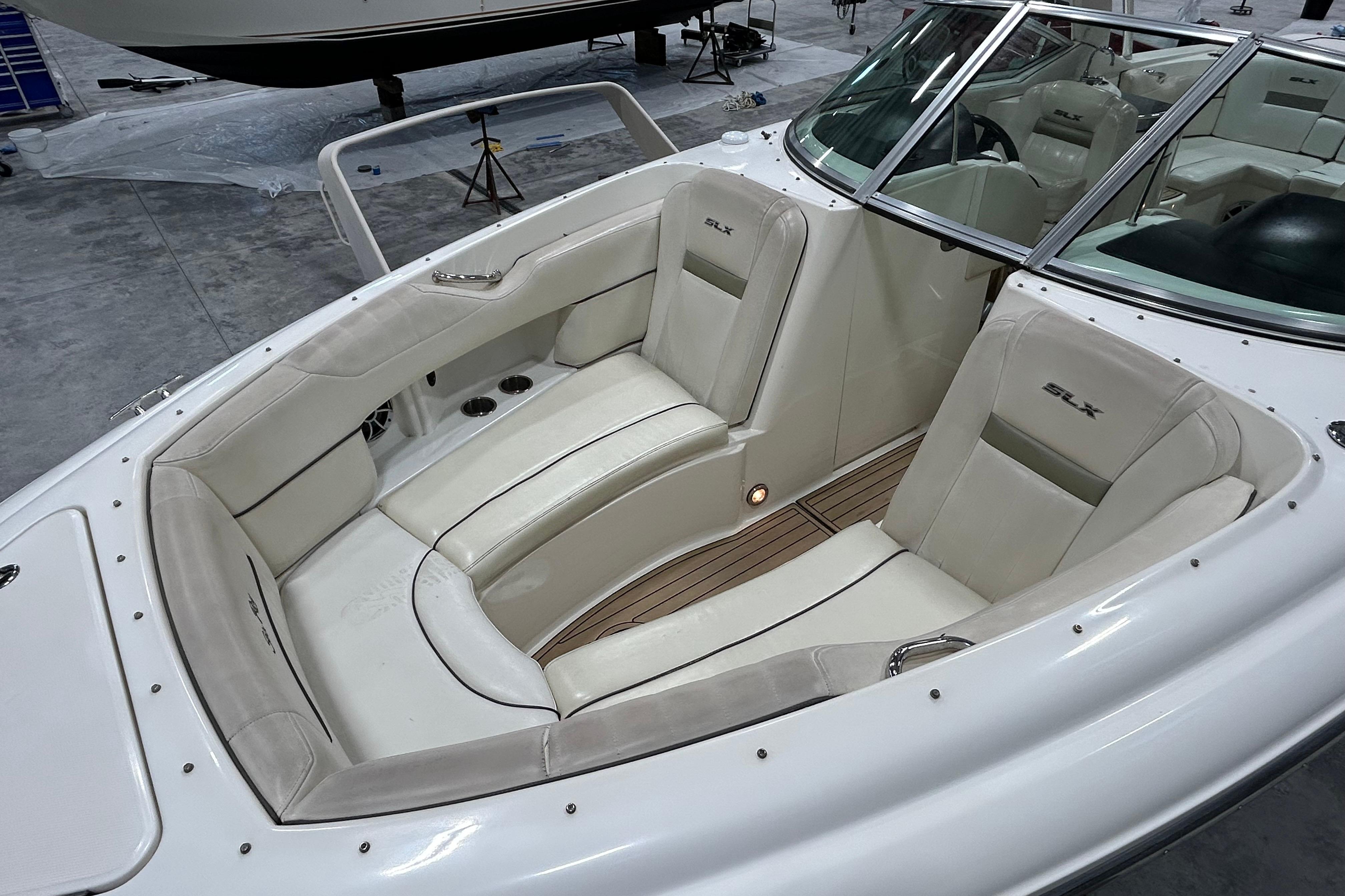 2006 Sea Ray 270 SLX boat interior with white cushioned seating and sleek design.