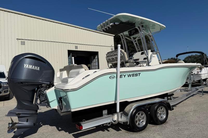 2025 Key West 239 FS boat on trailer with Yamaha outboard motor, parked outdoors.