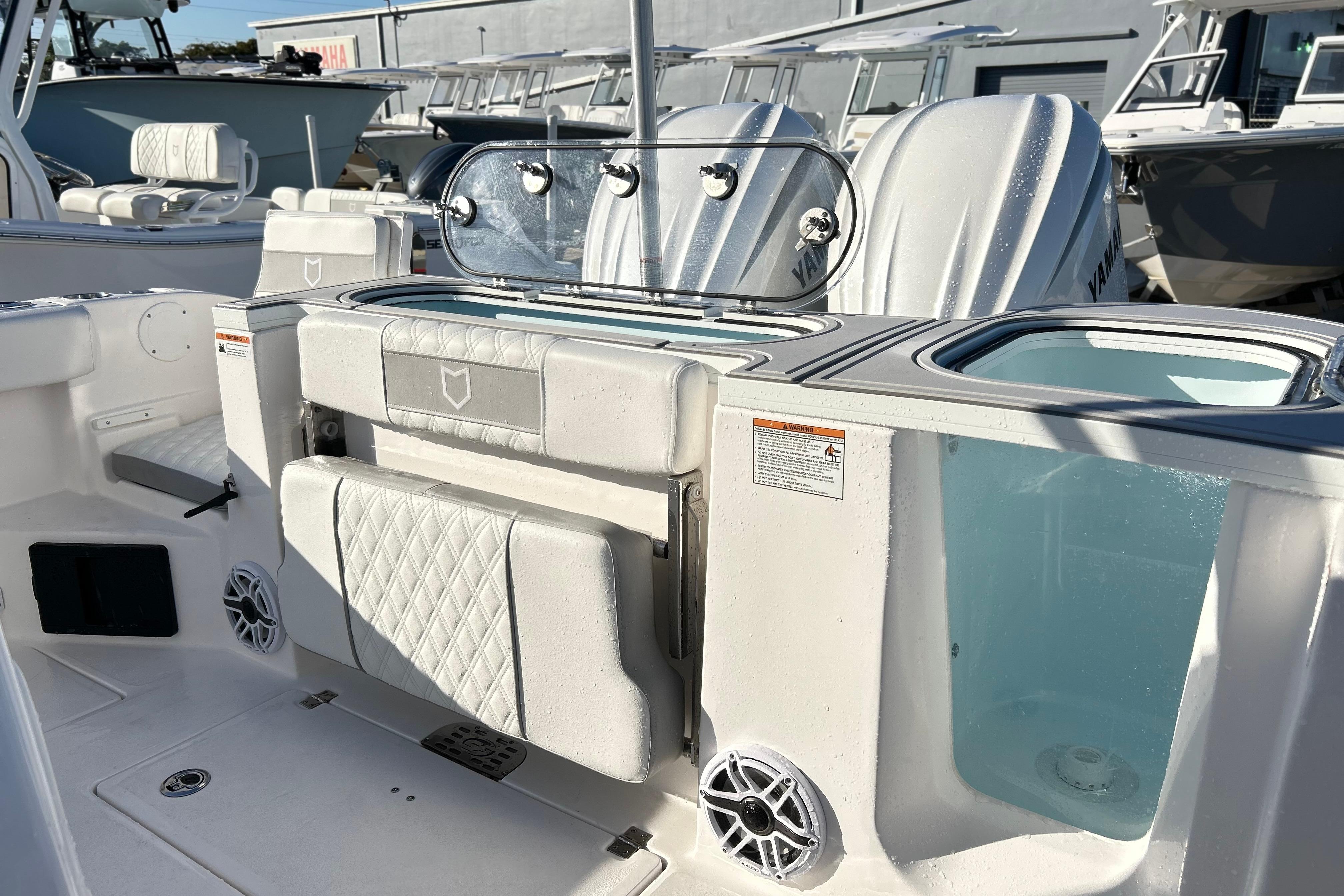 2026 Sea Fox 288 Commander boat interior with seating and storage compartments.