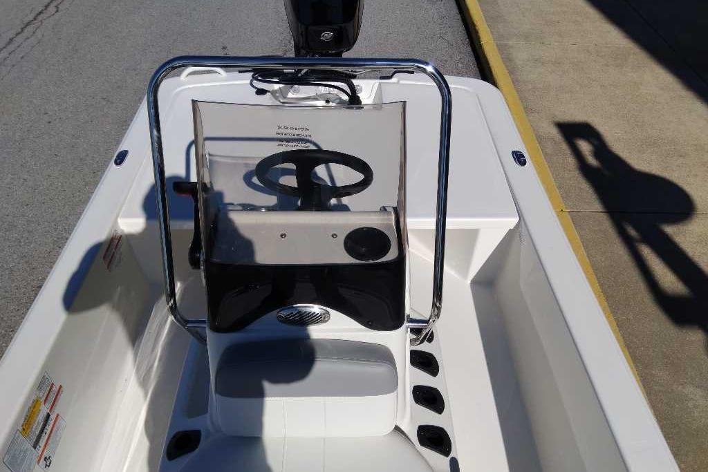 2026 Mako Pro Skiff 13 CC boat interior with steering console and seating.