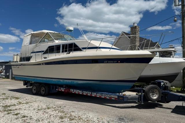 1980 Chris-Craft 381 Catalina boat on trailer under blue sky.