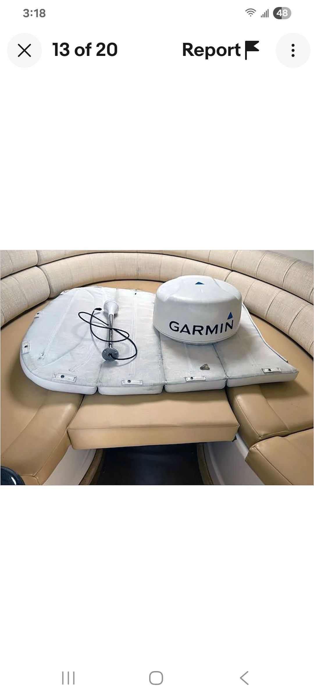 Interior of a boat with Garmin equipment on a seat.
