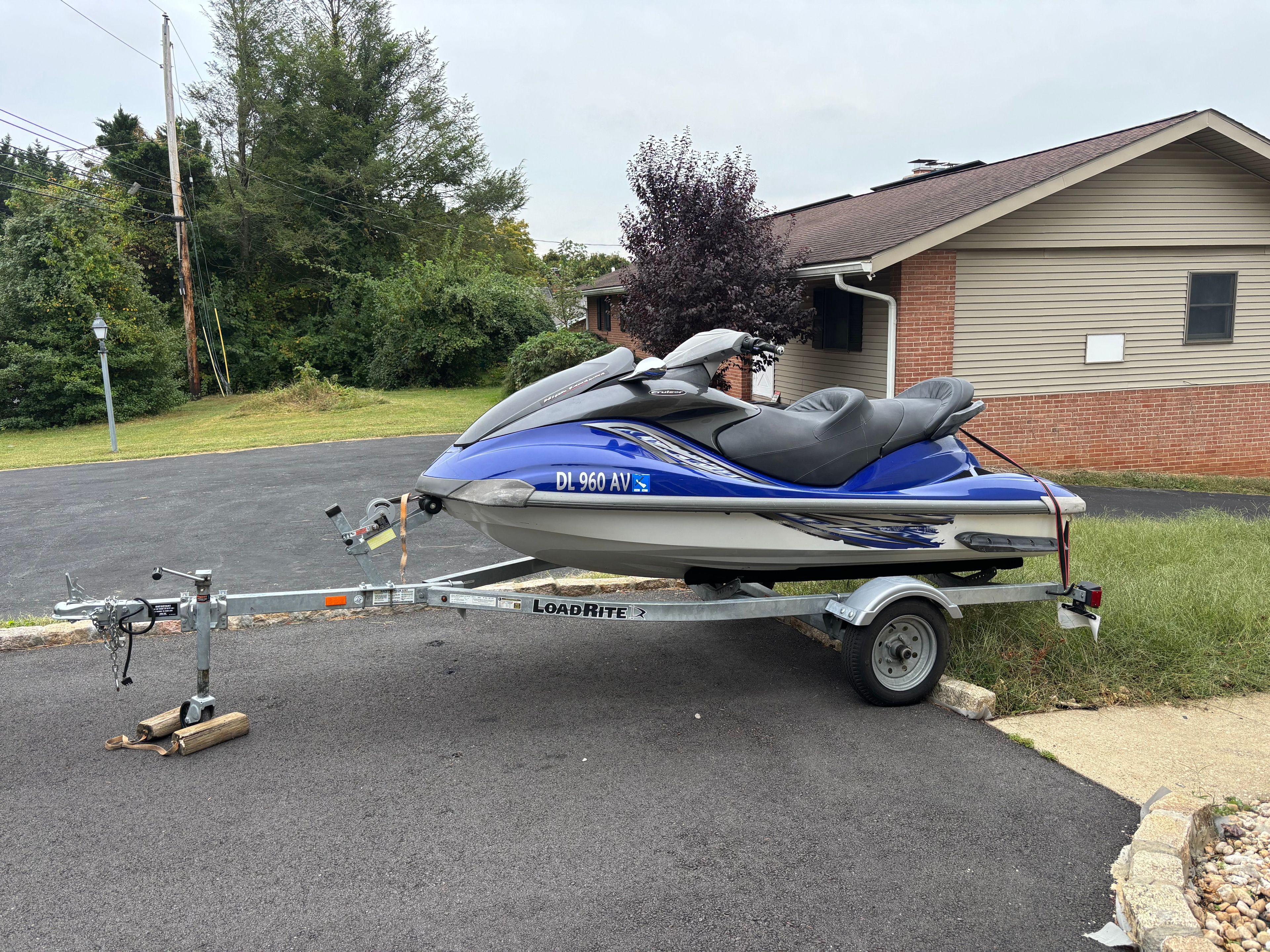 2005 Yamaha WaveRunner FX CRU HO on trailer, parked in residential driveway.