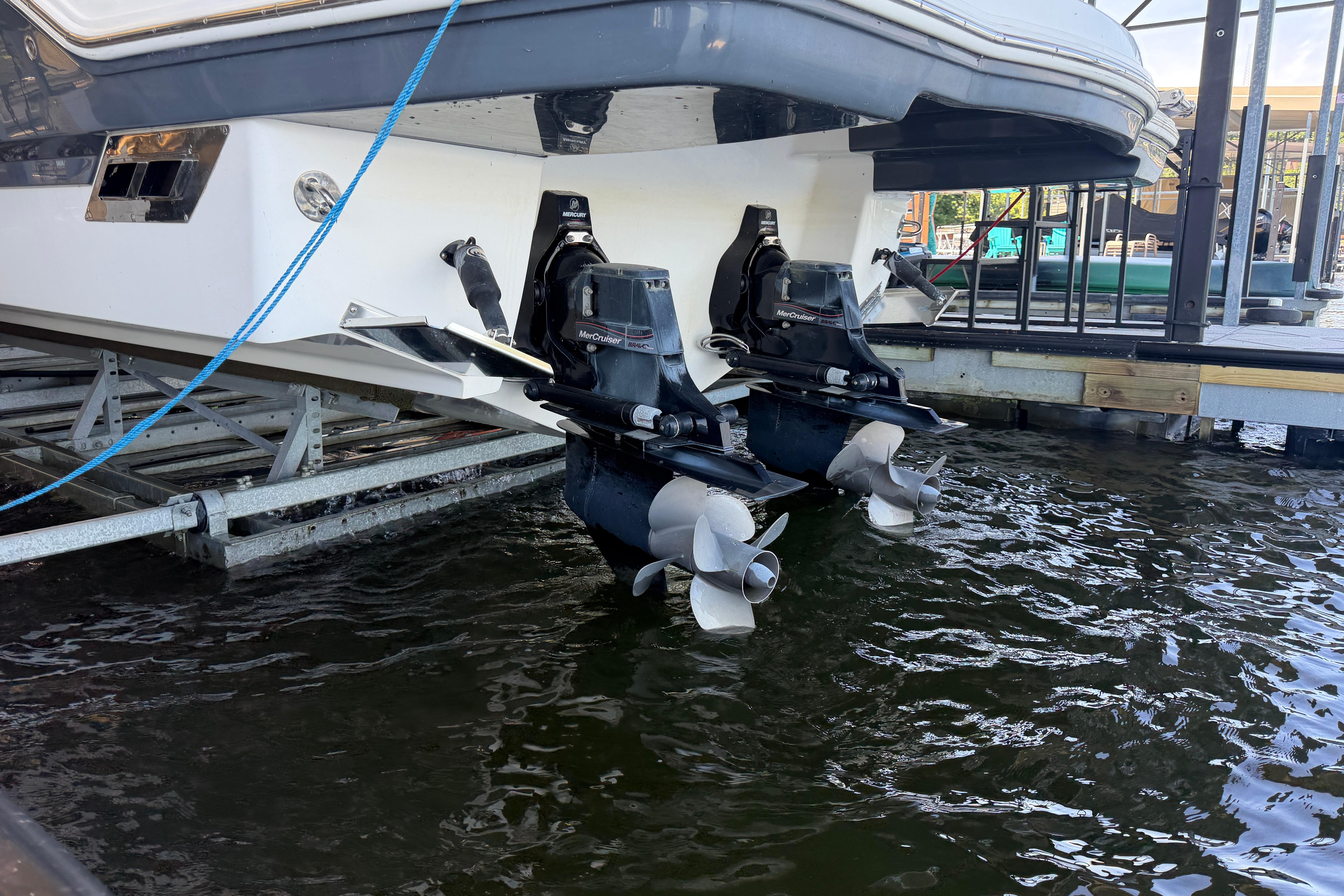 2018 Chaparral 347 SSX boat with dual propellers in docked position.