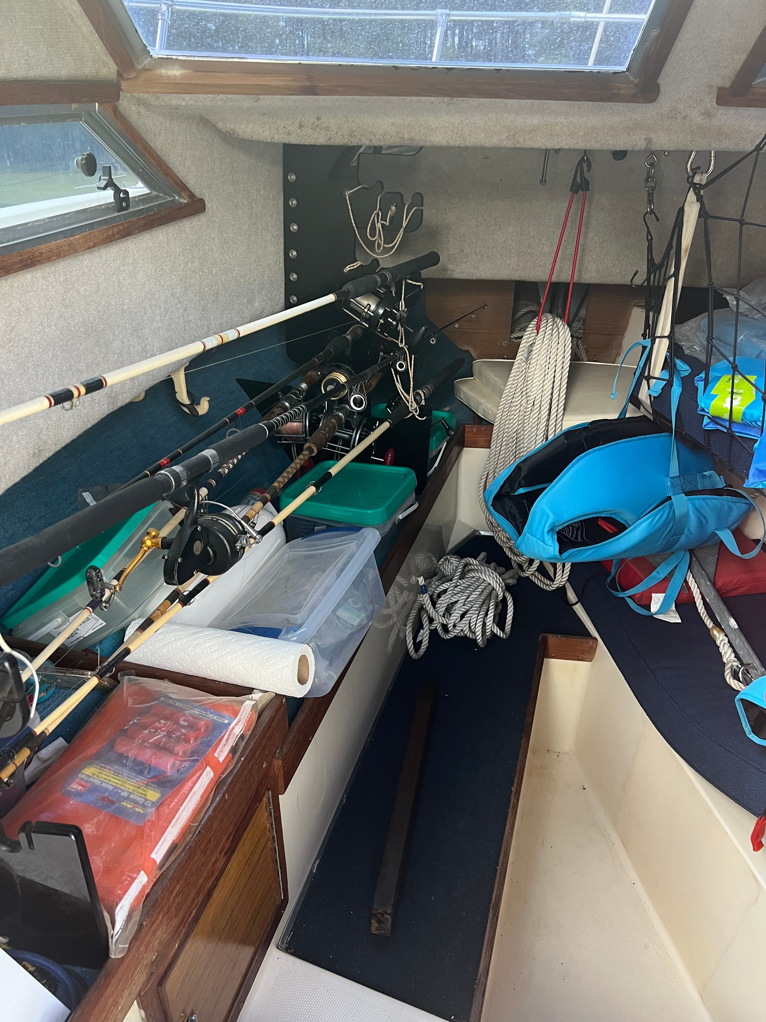 Interior of a 1987 Grady-White Gulfstream boat with fishing gear.