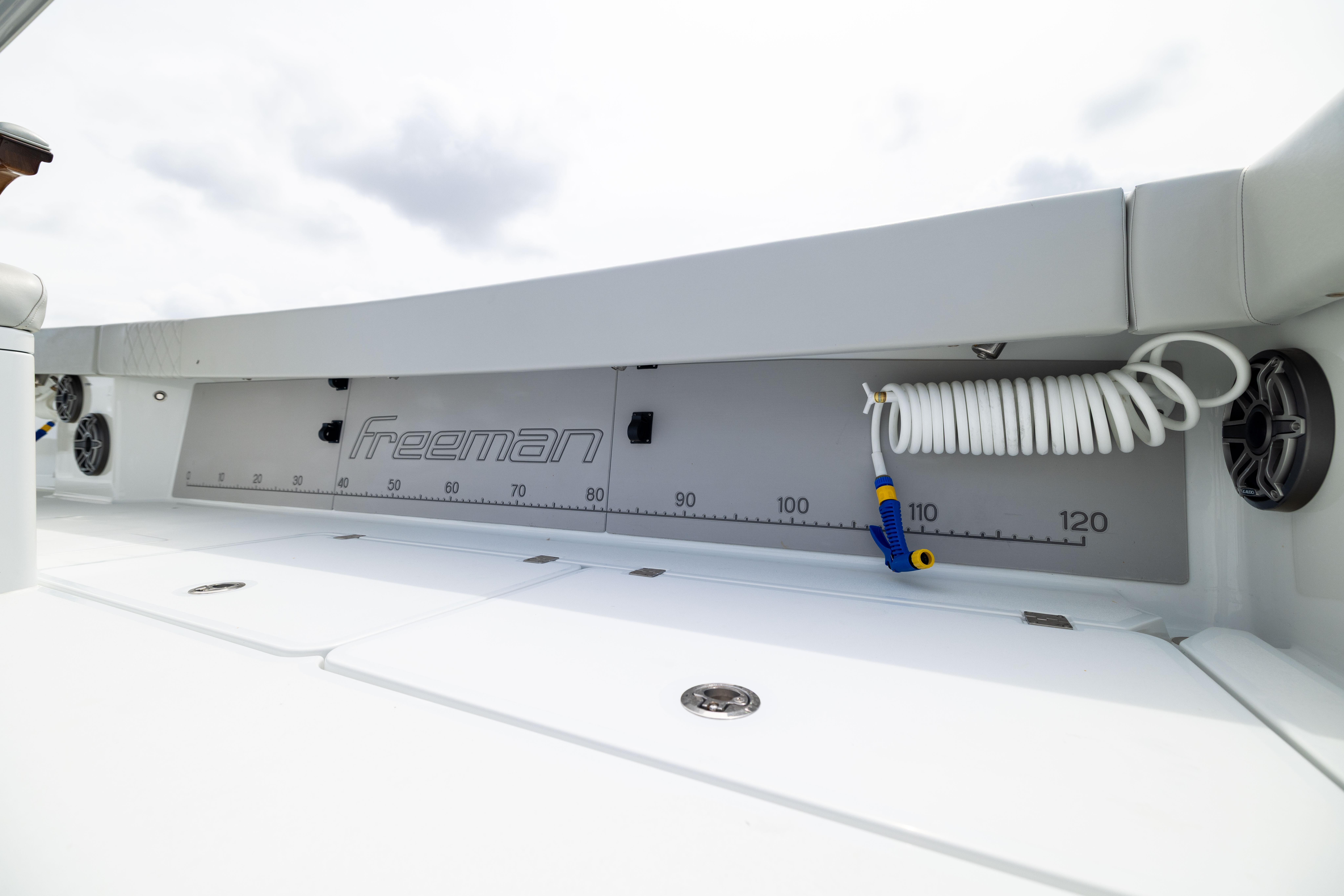 Freeman 42 LR 2025 boat deck with measuring scale and coiled hose.