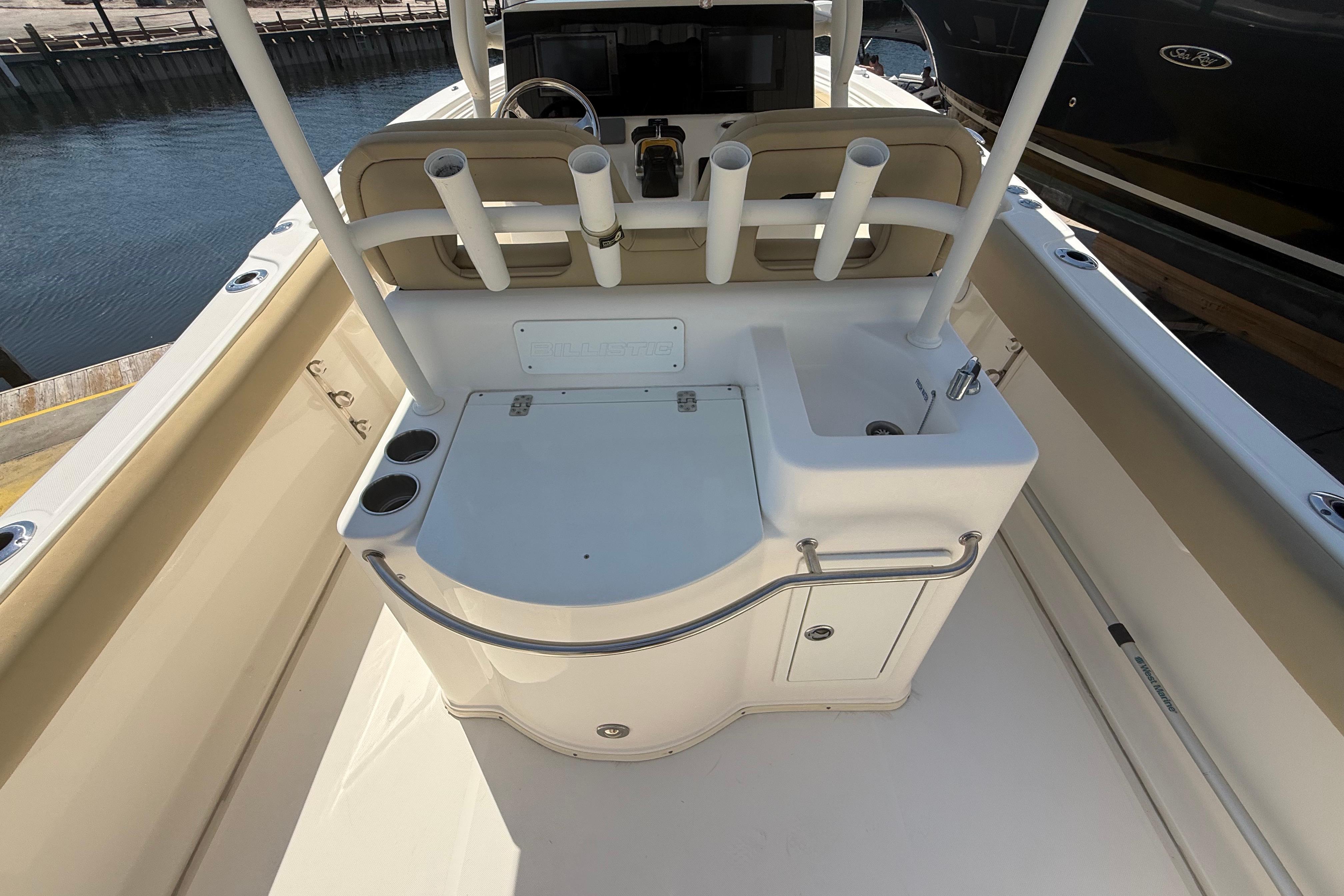 2019 Key West Billistic 281 Center Console boat interior with rod holders and sink.