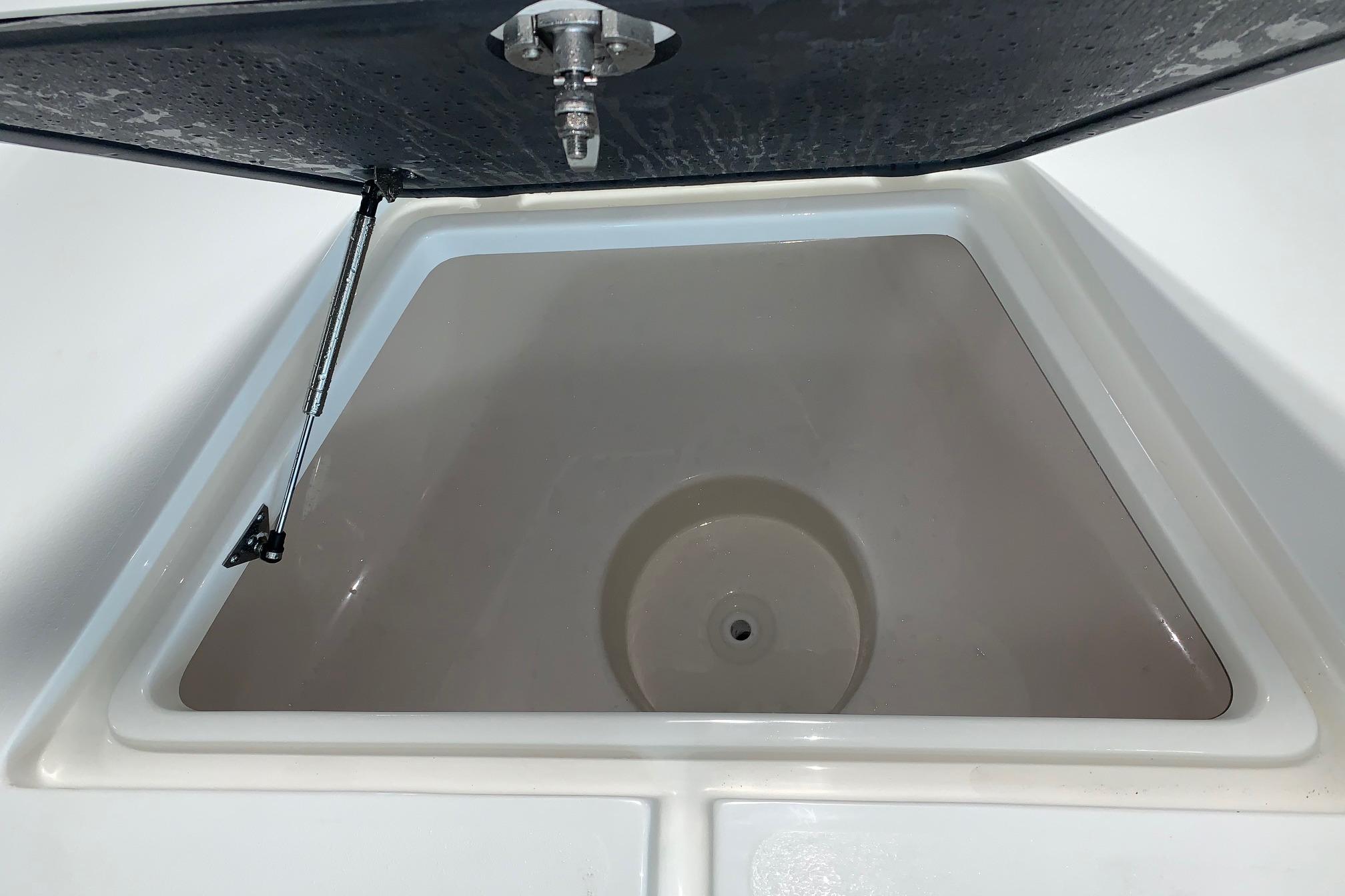 Open storage compartment on 2026 Key West 188 Bay Reef boat.