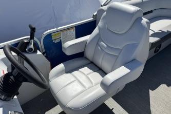 Captain's seat of 2021 Godfrey Sweetwater 2286 C pontoon boat, featuring plush white upholstery.
