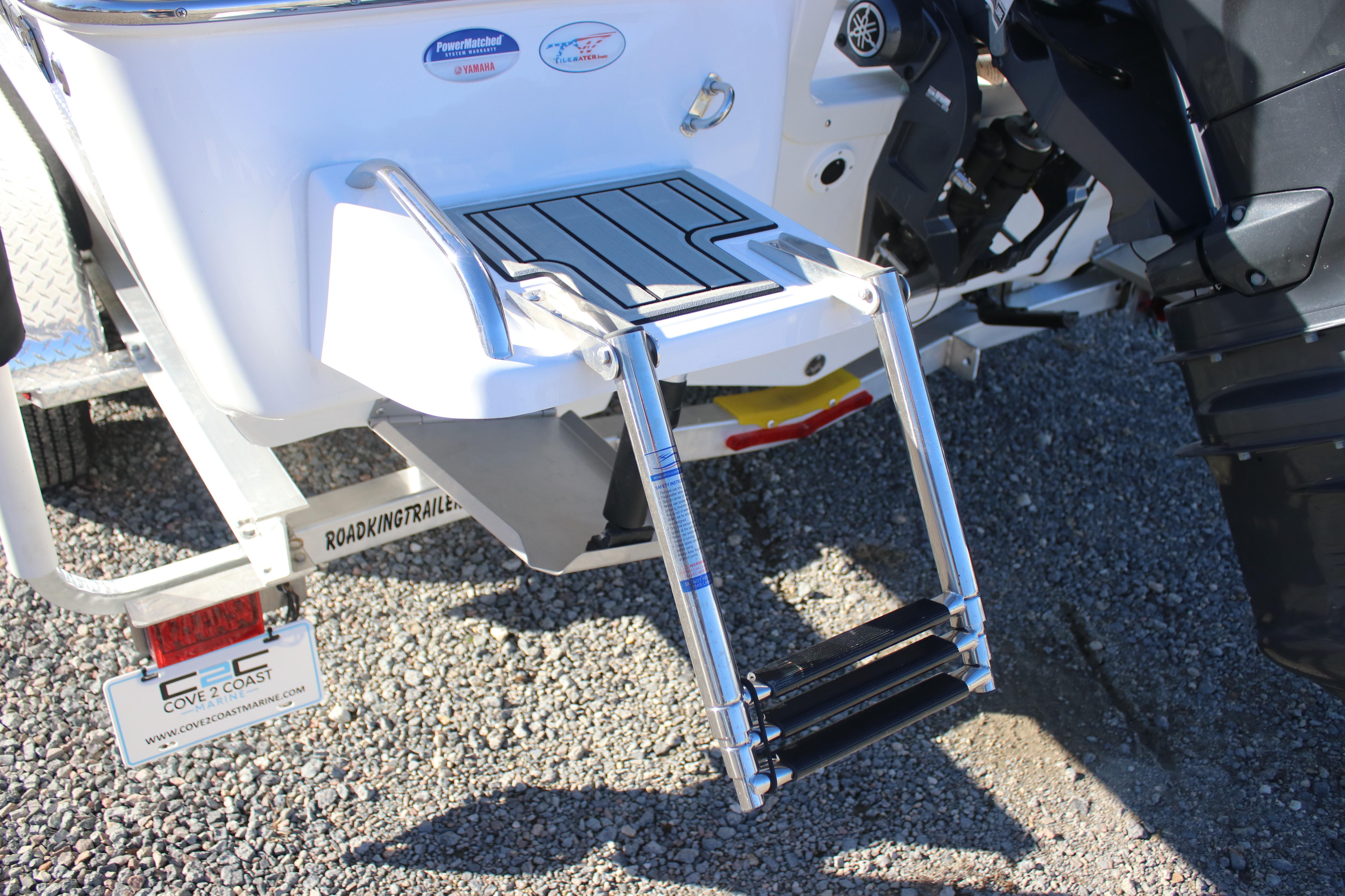 2026 Tidewater 2210 Carolina Bay boat with a foldable swim ladder and Yamaha engine.