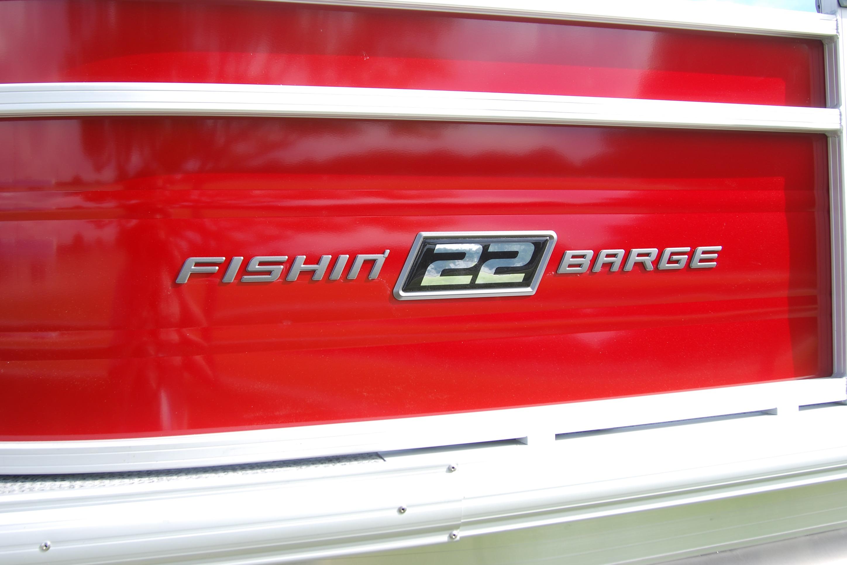 Red Sun Tracker Fishin' Barge 22 XP3, 2026 model, with sleek metallic lettering.