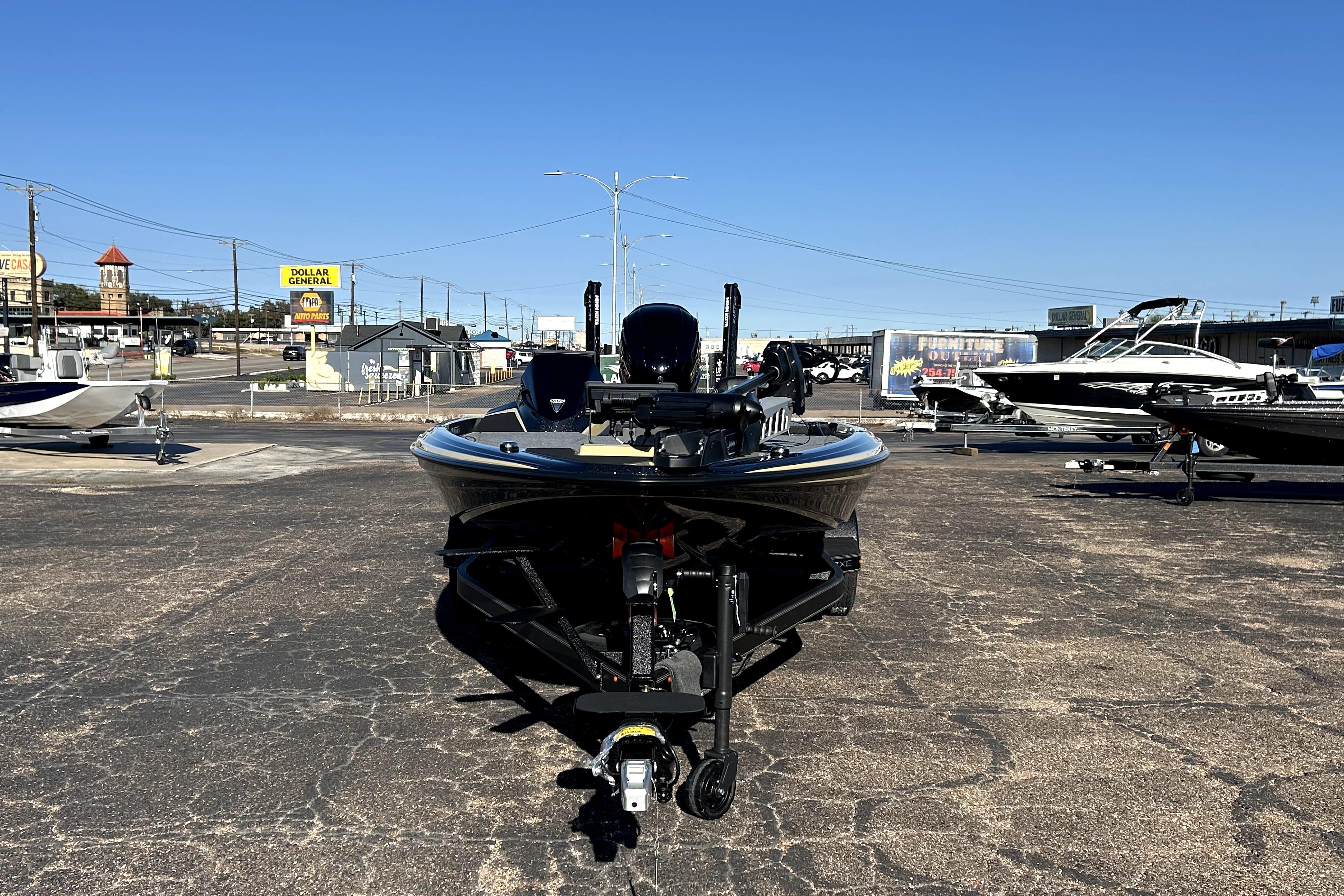 2026 Skeeter ZXE21 boat on display in a parking lot under clear blue skies.