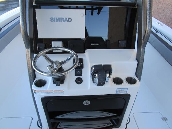 2025 Sea Pro 292 Offshore helm with Simrad display and controls.