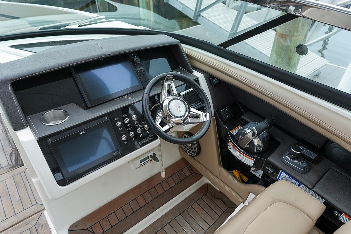 2018 Sea Ray SLX 350 helm with modern controls and navigation screens.