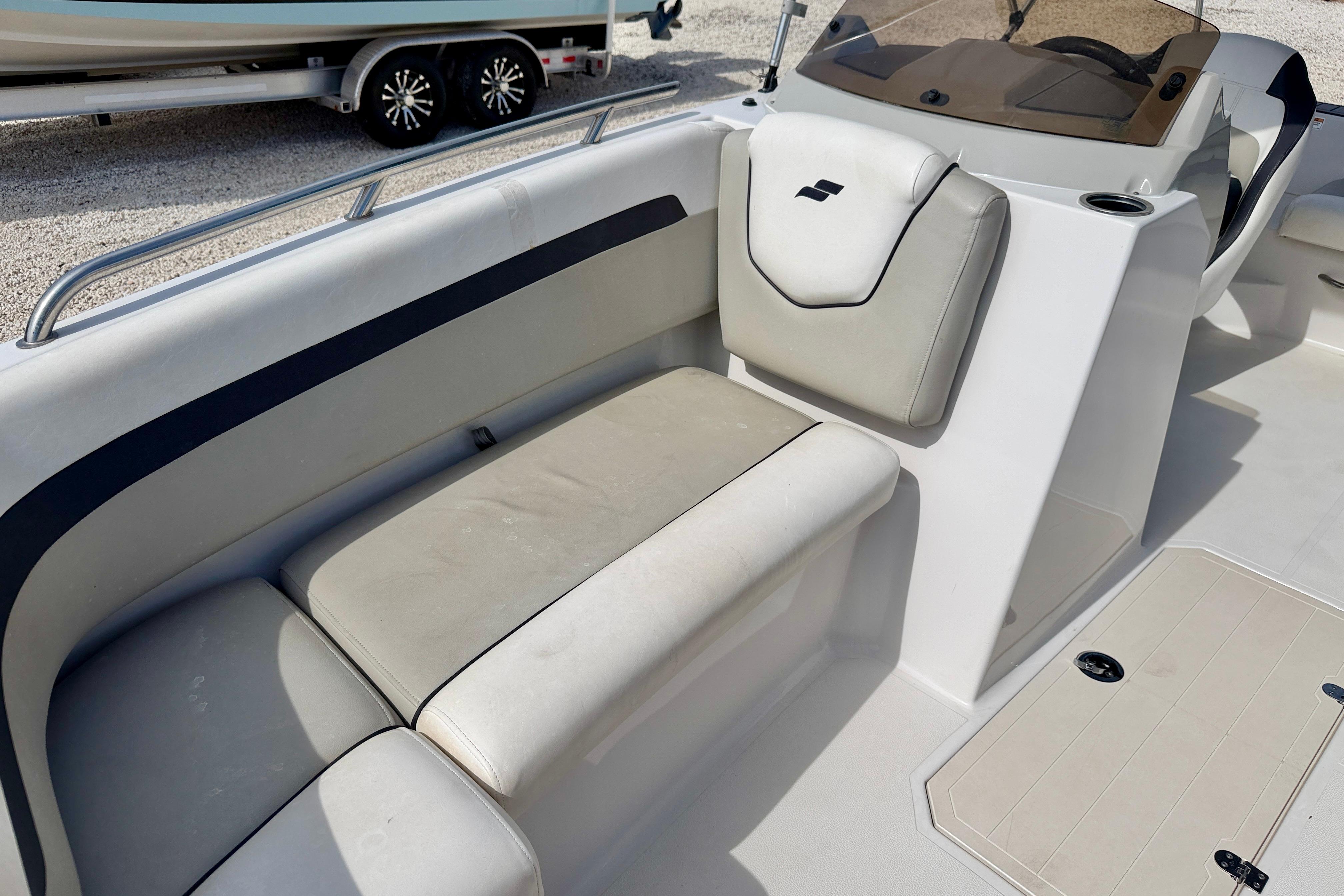 Interior seating of 2021 Starcraft SVX 191 OB boat, featuring cushioned seats and sleek design.