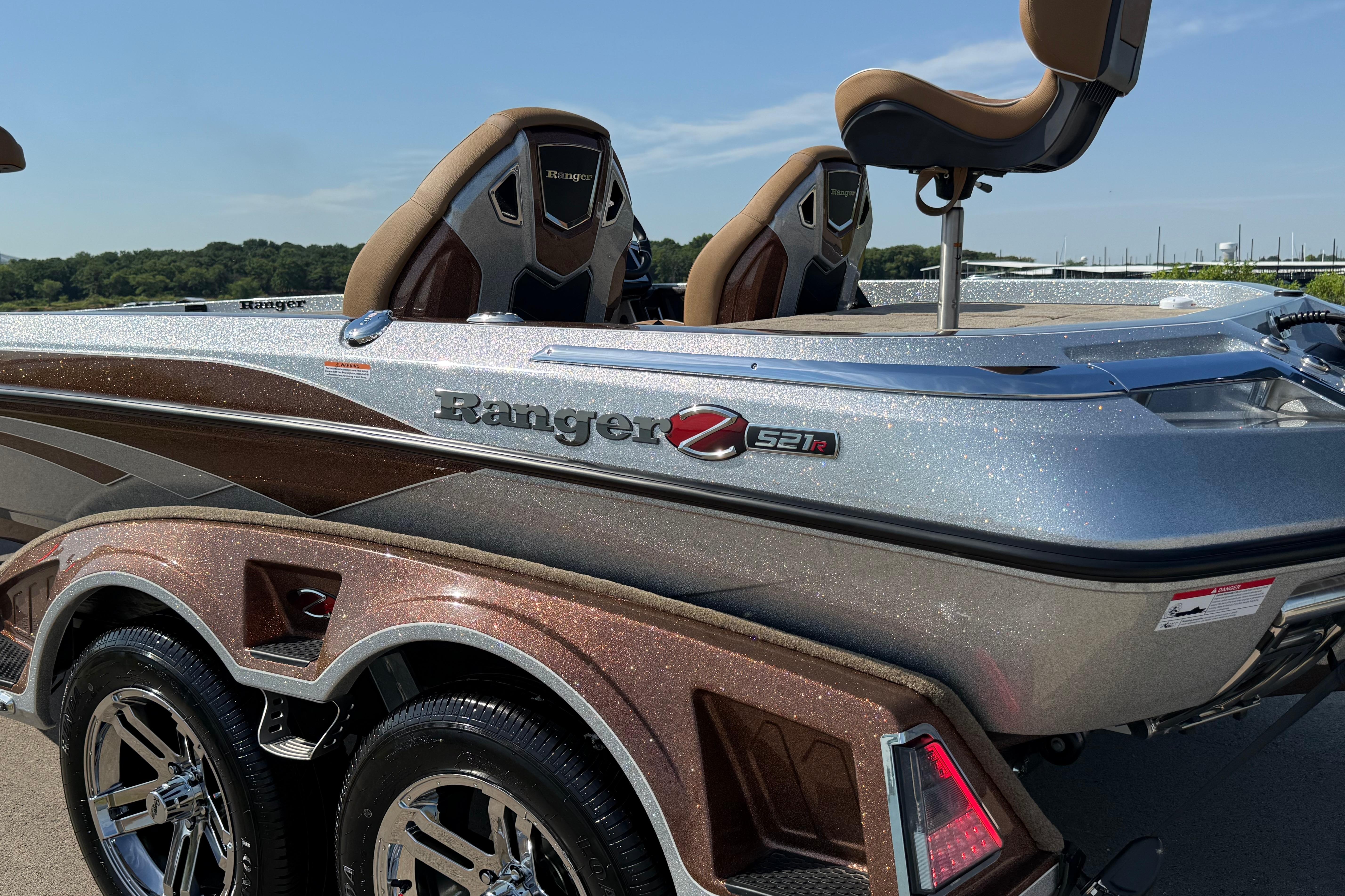 2026 Ranger Z521R boat with sleek design and metallic finish on a sunny day.