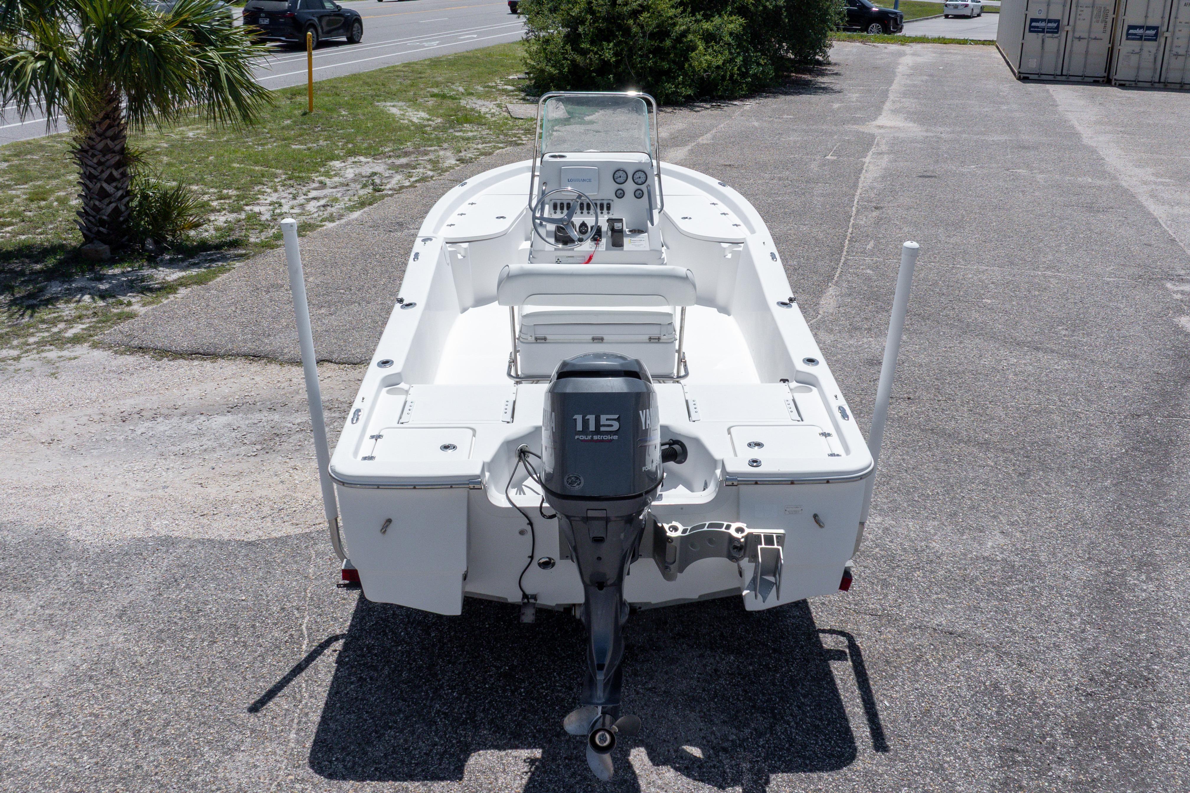 2011 Sea Fox 200XT boat with Yamaha 115 outboard motor, parked on pavement.