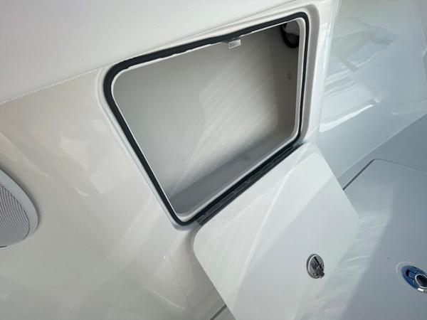 Open storage compartment on a 2025 Mag Bay 43 Center Console boat.