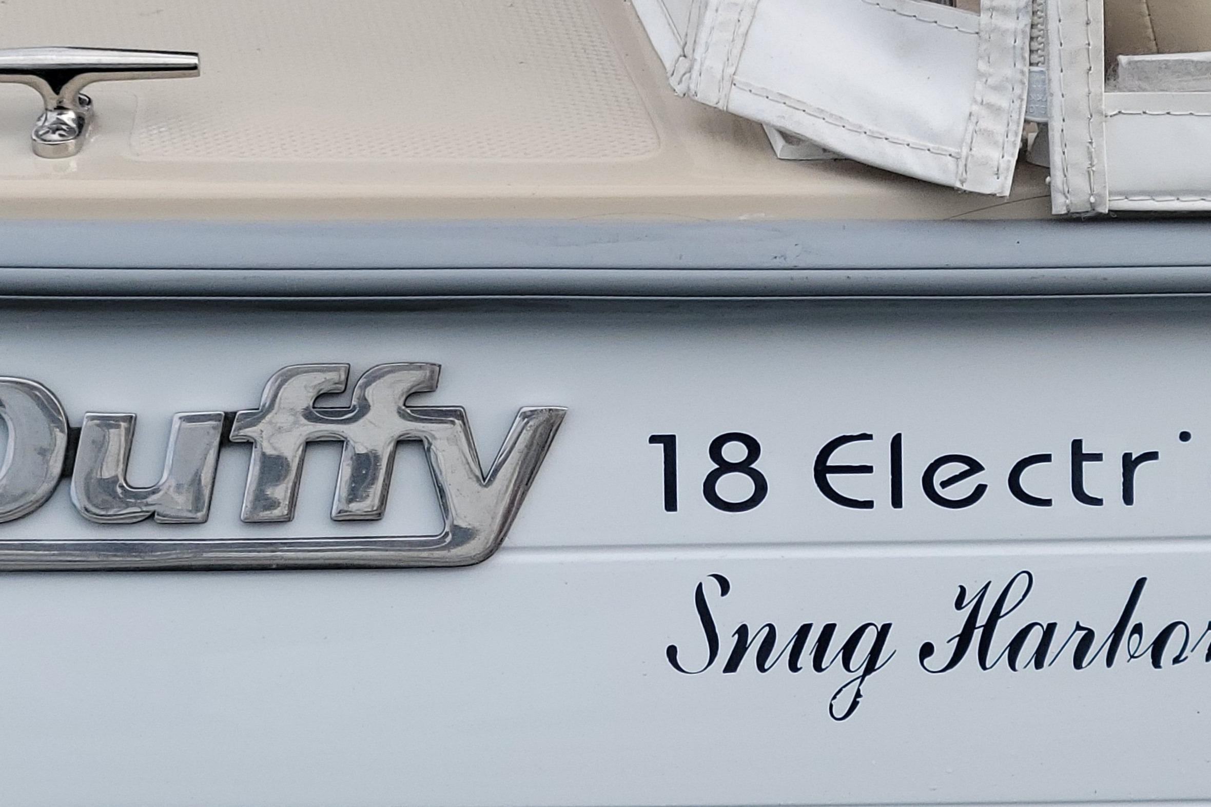 Close-up of 2008 Duffy Snug Harbor 18 Electric boat branding.