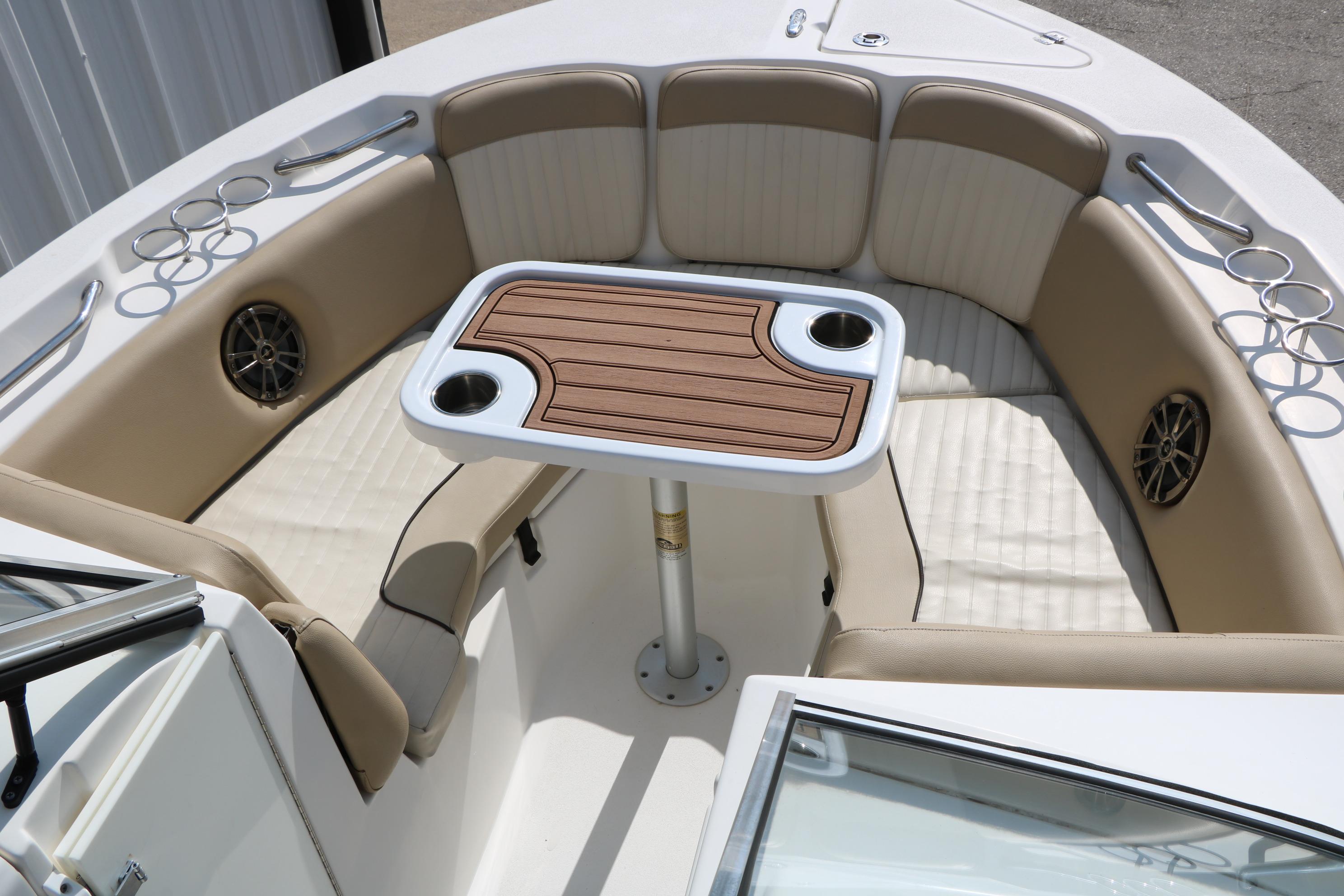 2017 Sea Fox 226 Traveler boat interior with cushioned seating and a central table.