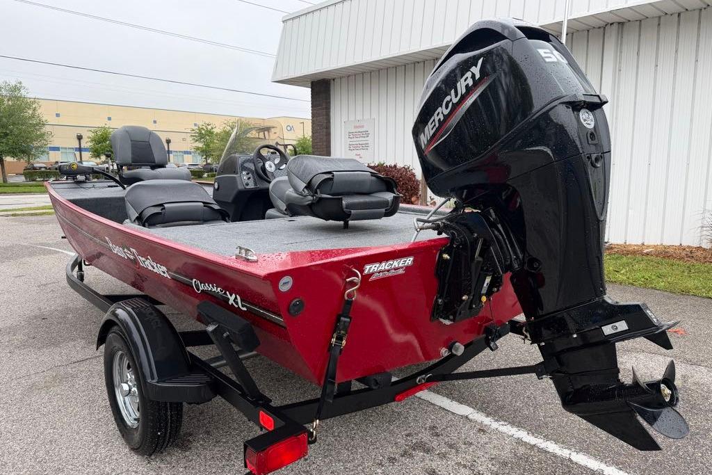 2026 Tracker Bass Tracker Classic XL boat with Mercury engine, parked outdoors.