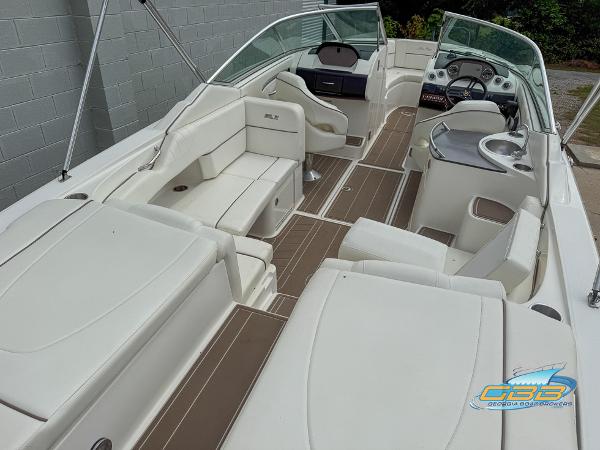 2008 Sea Ray 270 SLX boat interior with white seating and brown flooring.