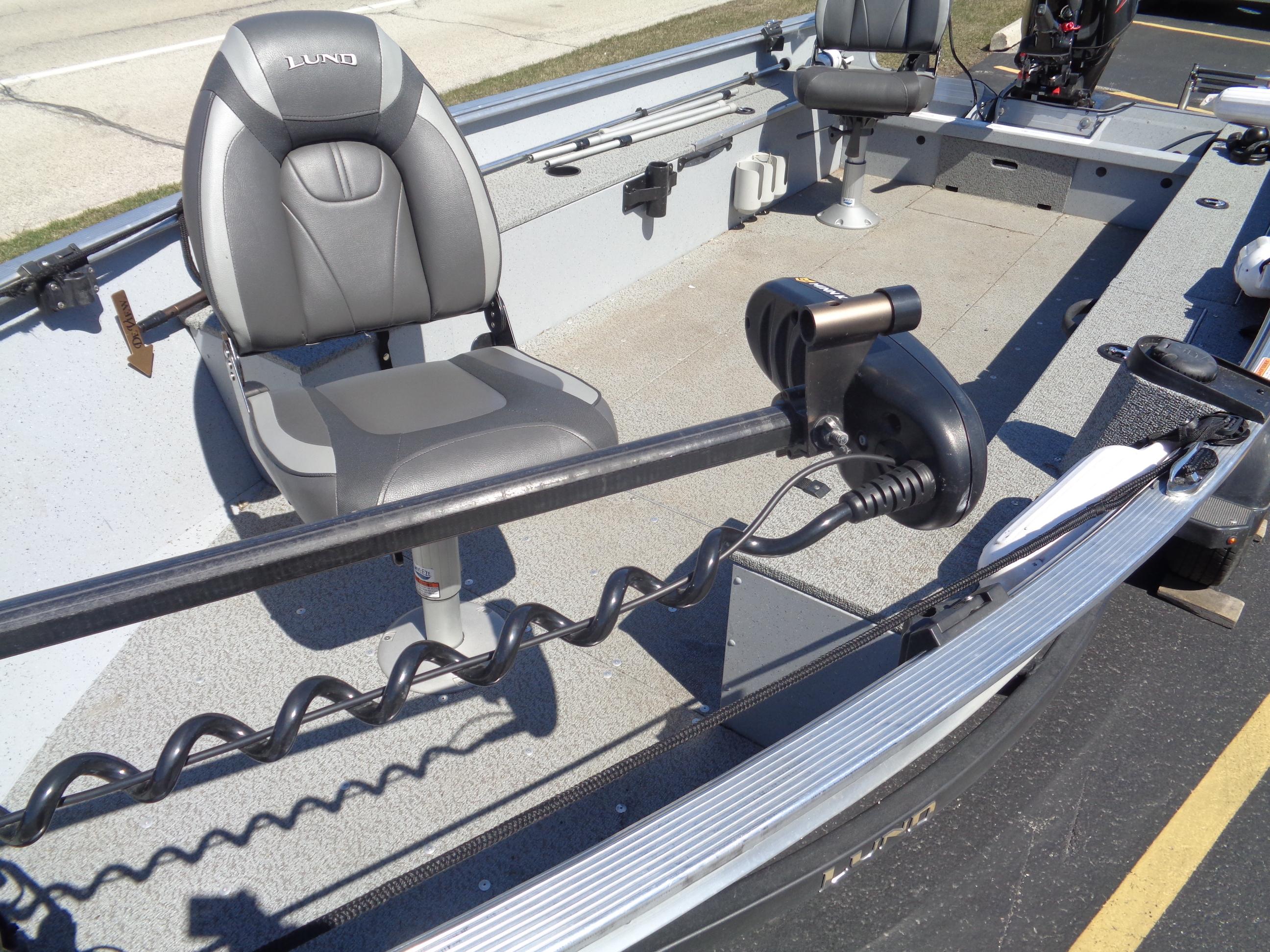 2023 Lund 1600 Alaskan Tiller boat interior with seating and motor.