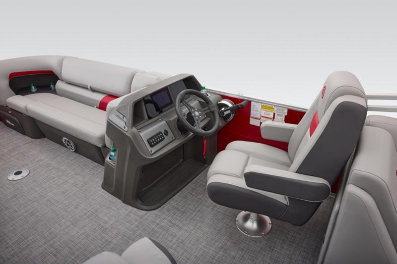 2026 Sun Tracker Party Barge 22 DLX interior with helm and seating area.
