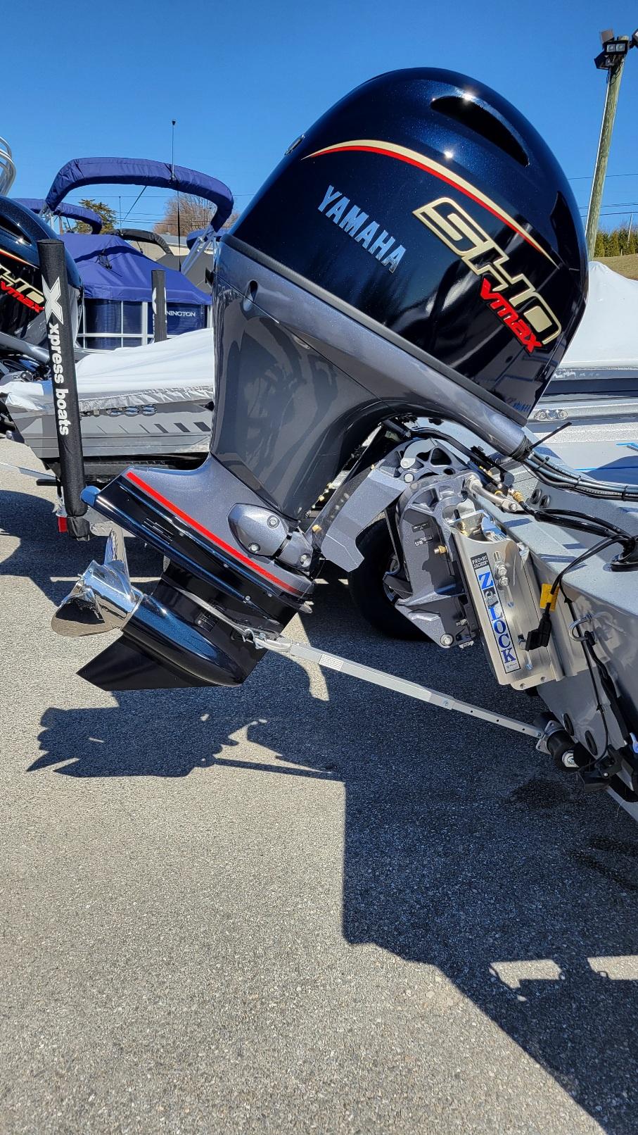 2025 Xpress H17C boat with Yamaha Vmax 90 engine, parked outdoors.