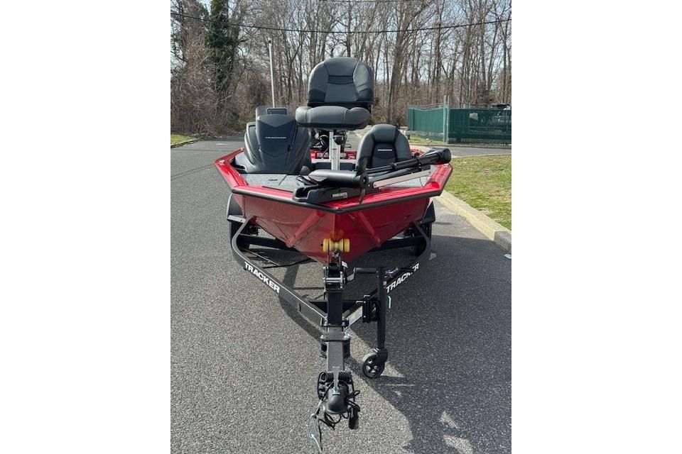 2026 Tracker Pro Team 175 boat on trailer, parked on asphalt road.