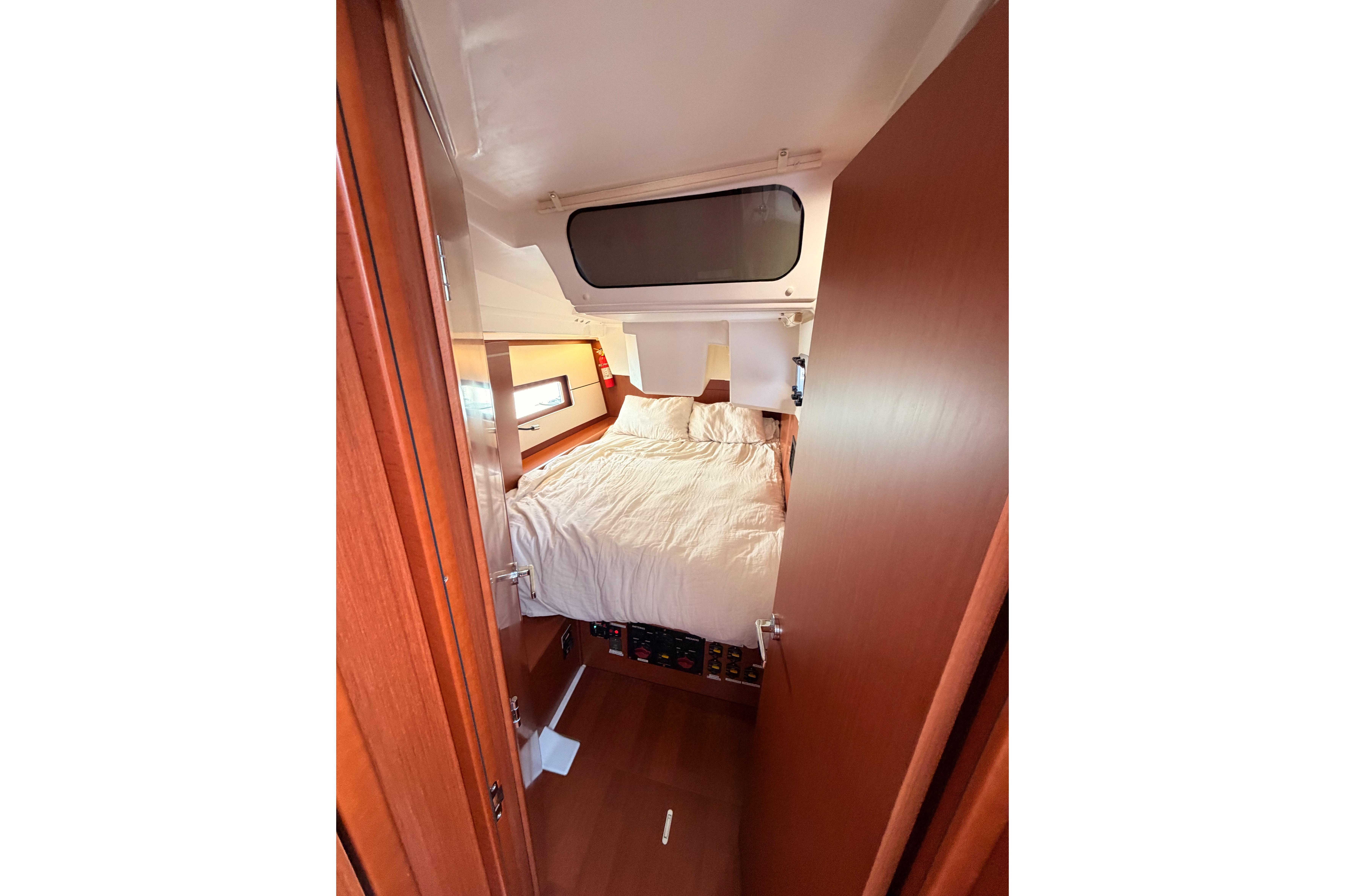 Cozy cabin interior of 2020 Beneteau Oceanis 46.1 yacht with comfortable bedding.