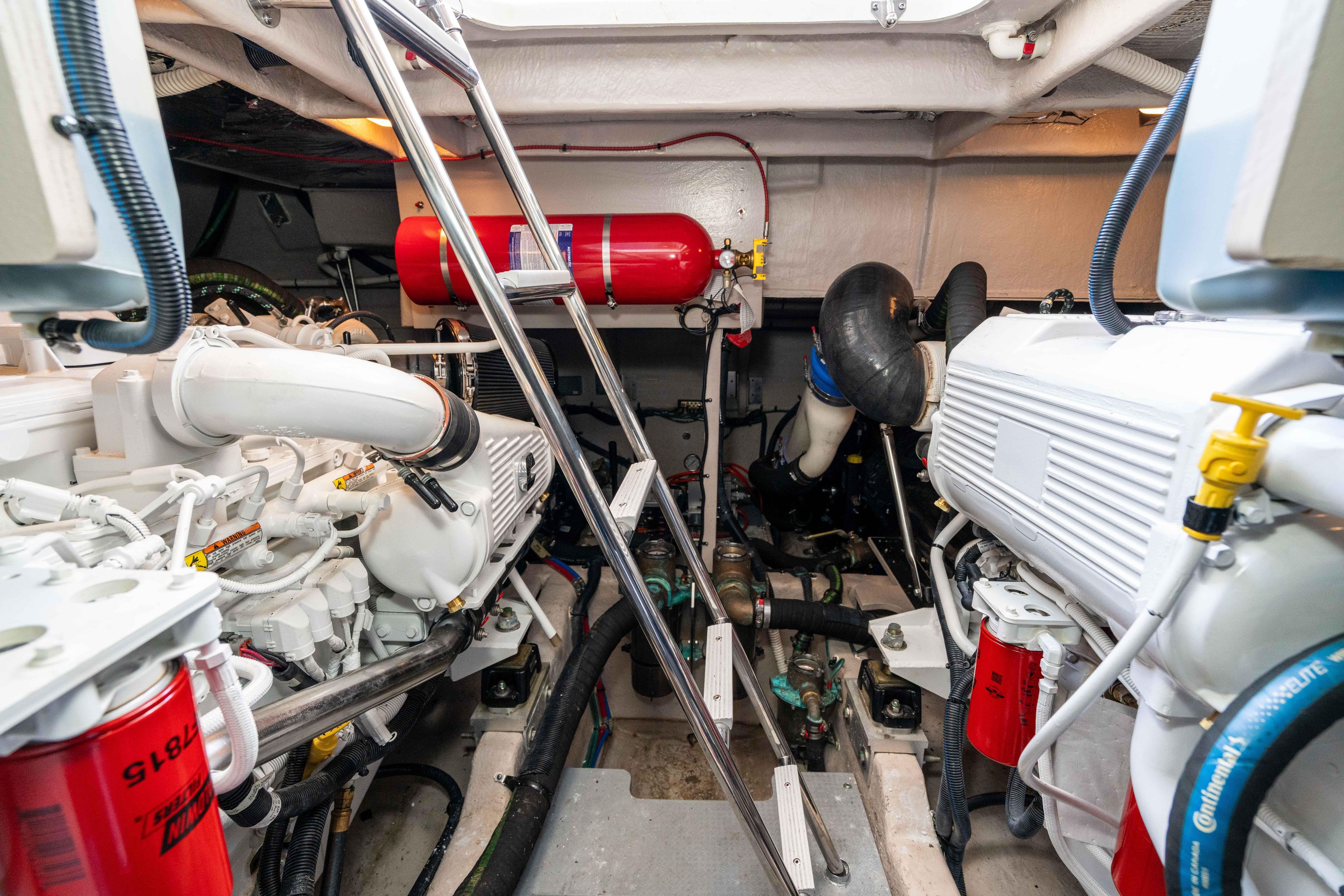 Engine room of 2017 Sea Ray 510 Fly yacht, showcasing mechanical components and systems.