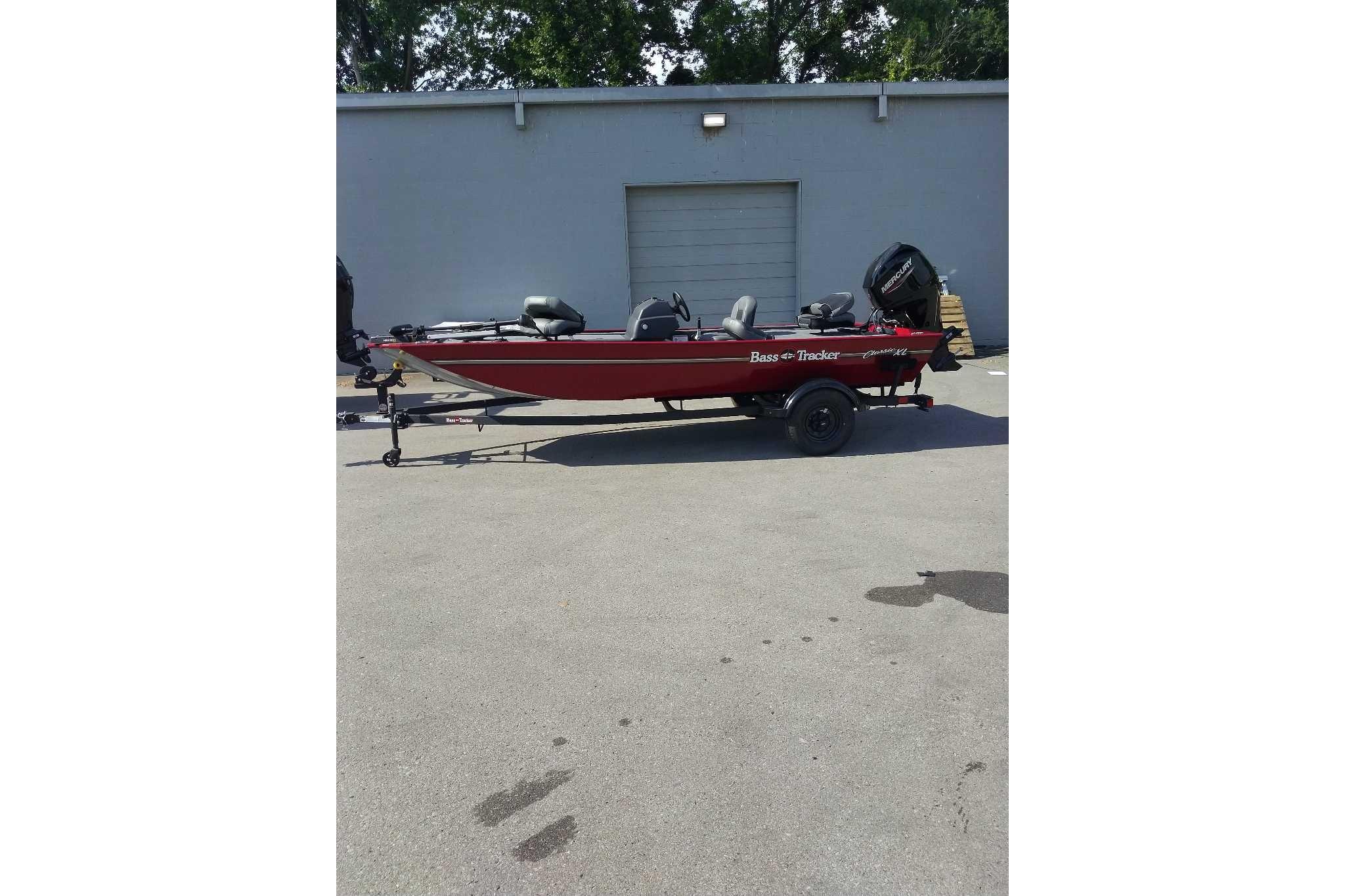 2026 Tracker Bass Tracker Classic XL boat on trailer, parked outdoors.