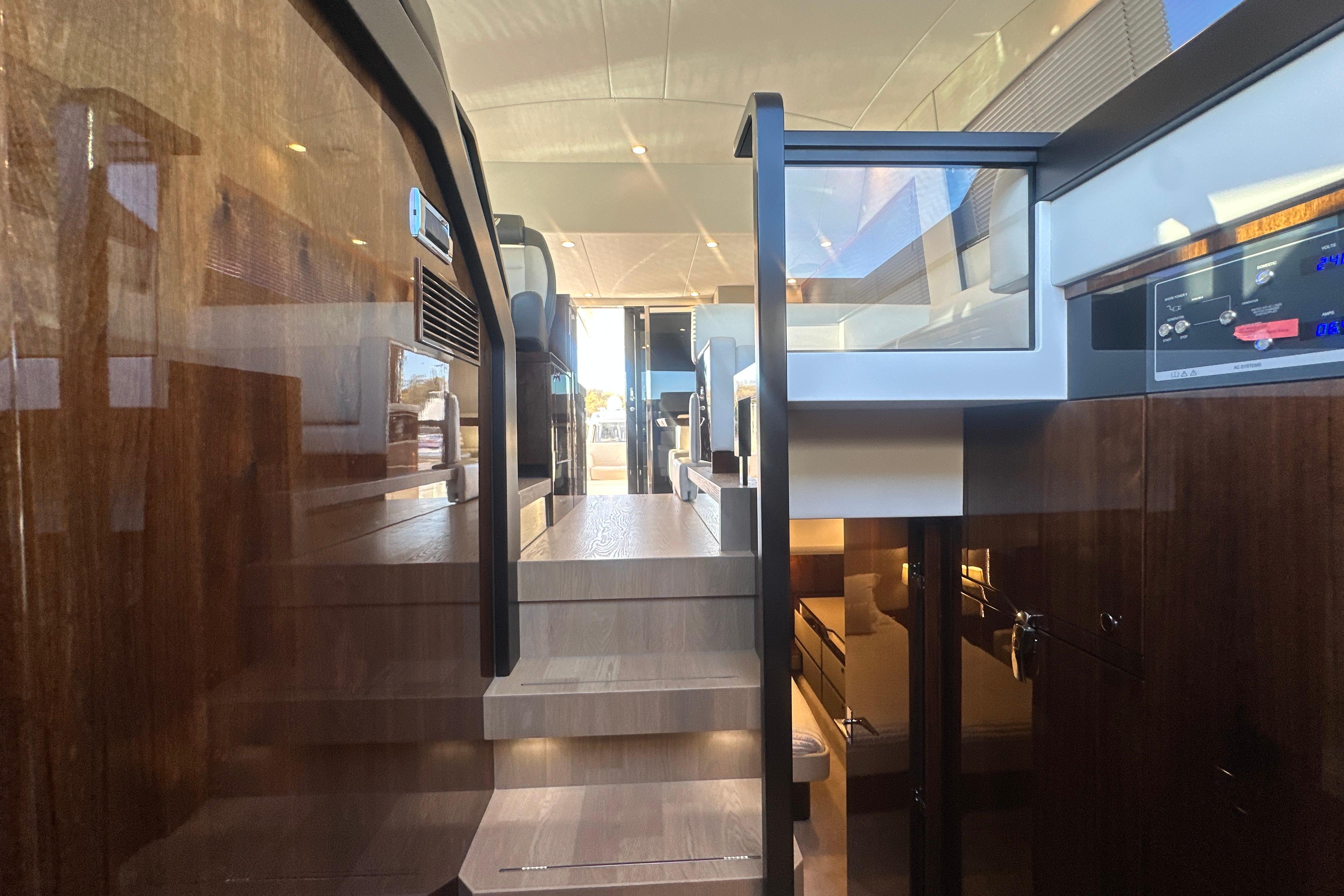 Interior view of 2024 Fairline Squadron 50 yacht, showcasing luxurious wooden finishes and modern design.