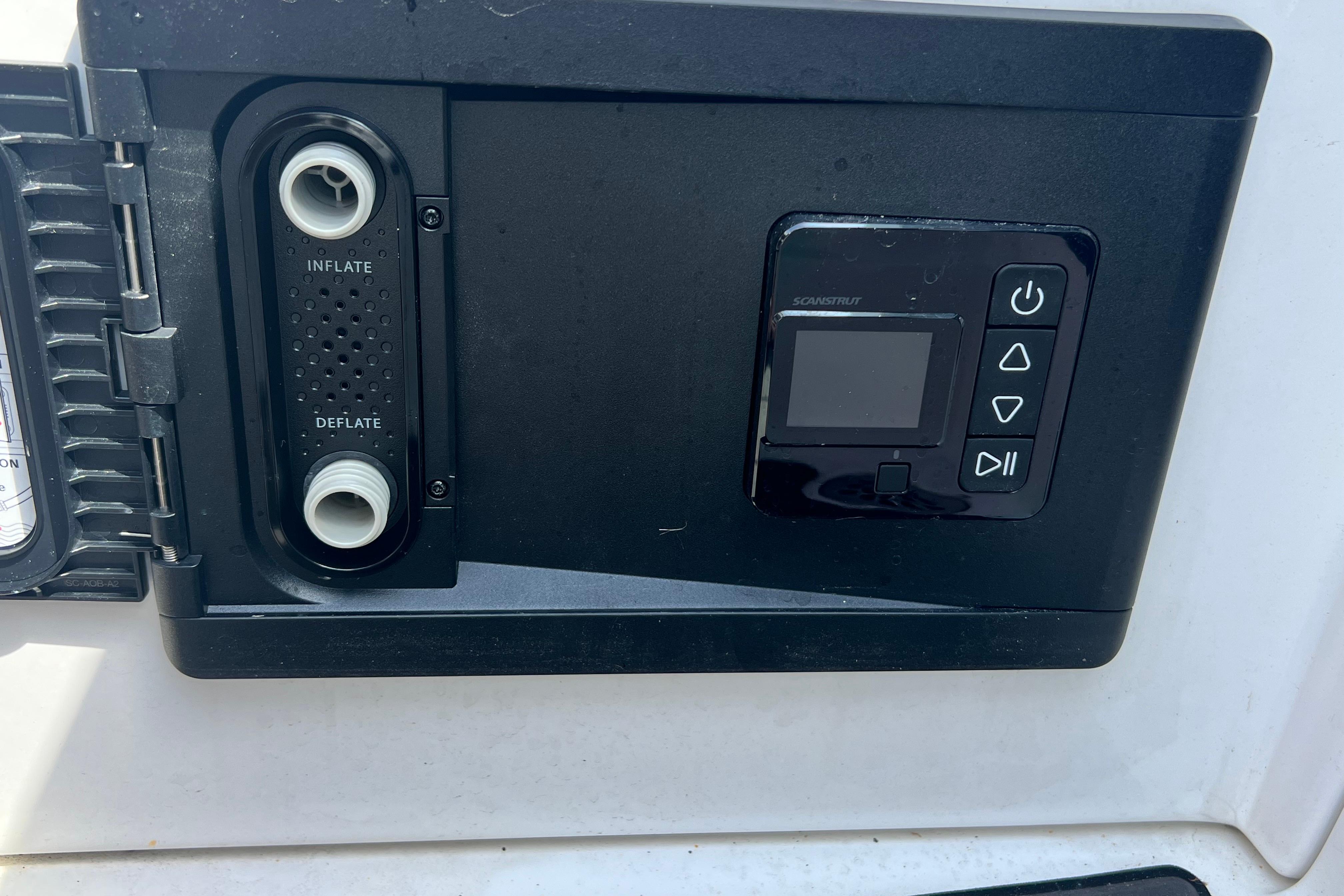 Control panel on a 2015 Monterey 268SS Super Sport boat, featuring inflate and deflate options.
