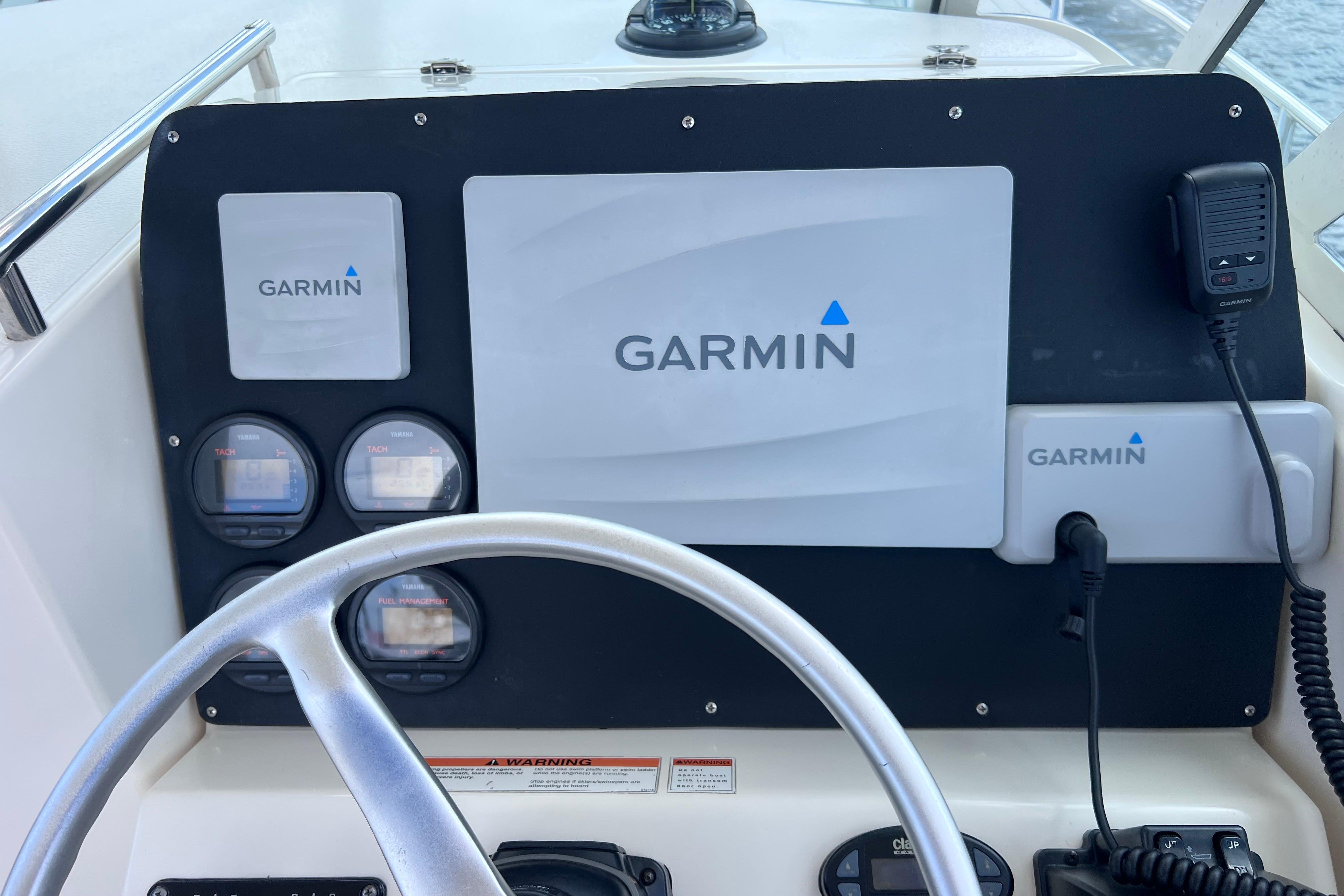 Dashboard of a 2004 Pursuit 2870 Walkaround with Garmin navigation equipment.