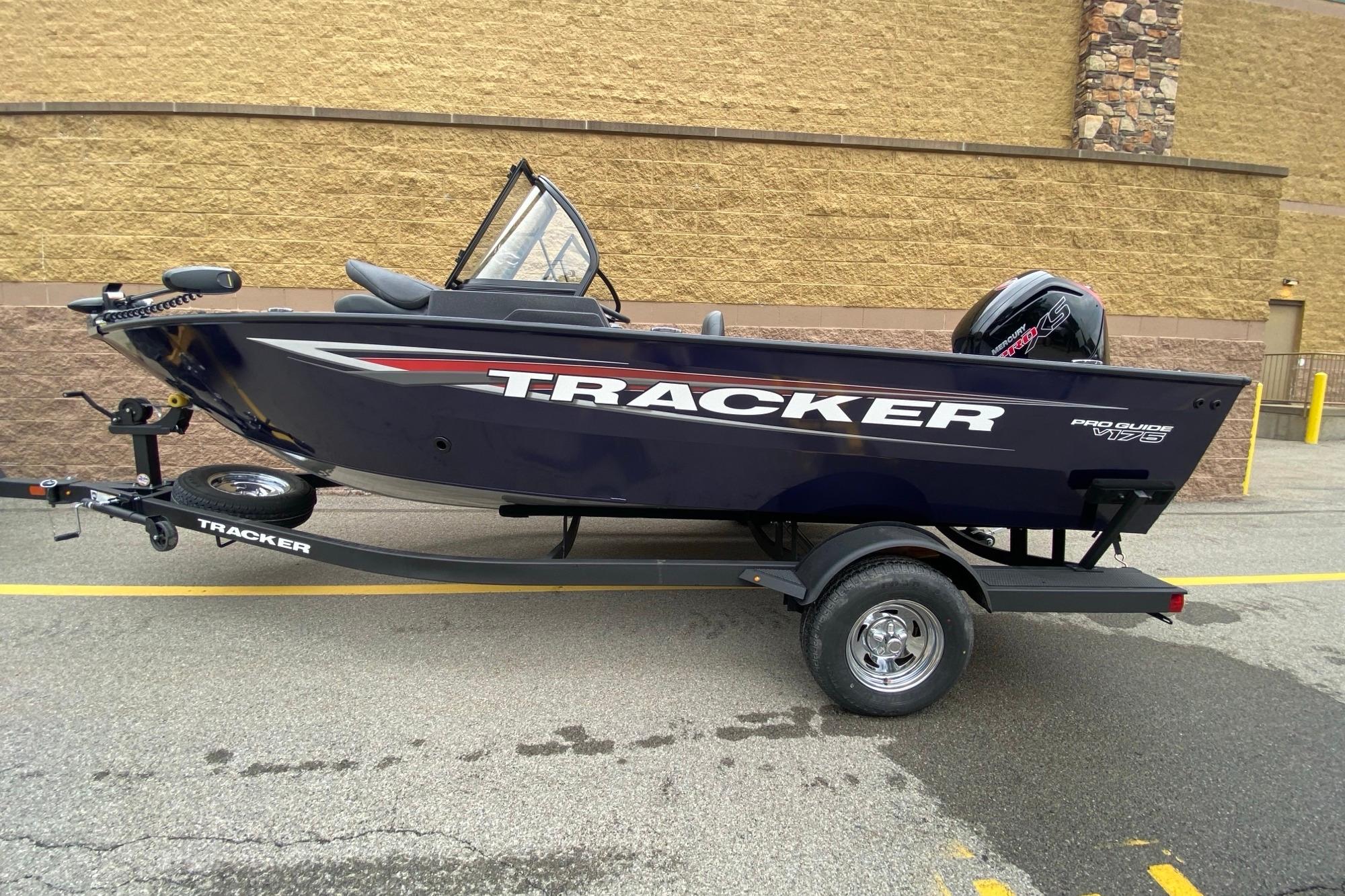 2026 Tracker Pro Guide V-175 WT boat on trailer, parked outdoors.