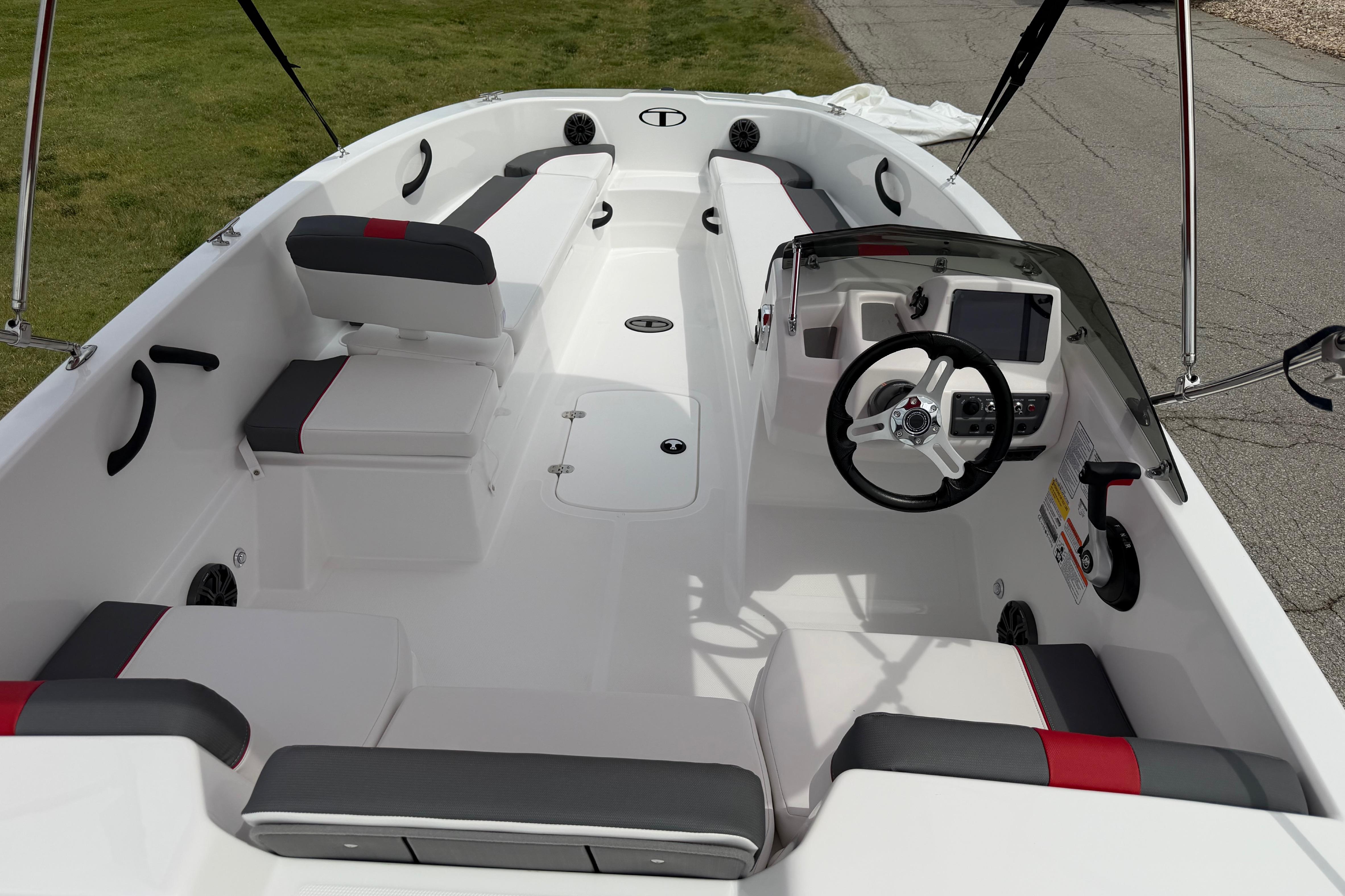2026 Tahoe T18 boat interior with modern seating and steering console.