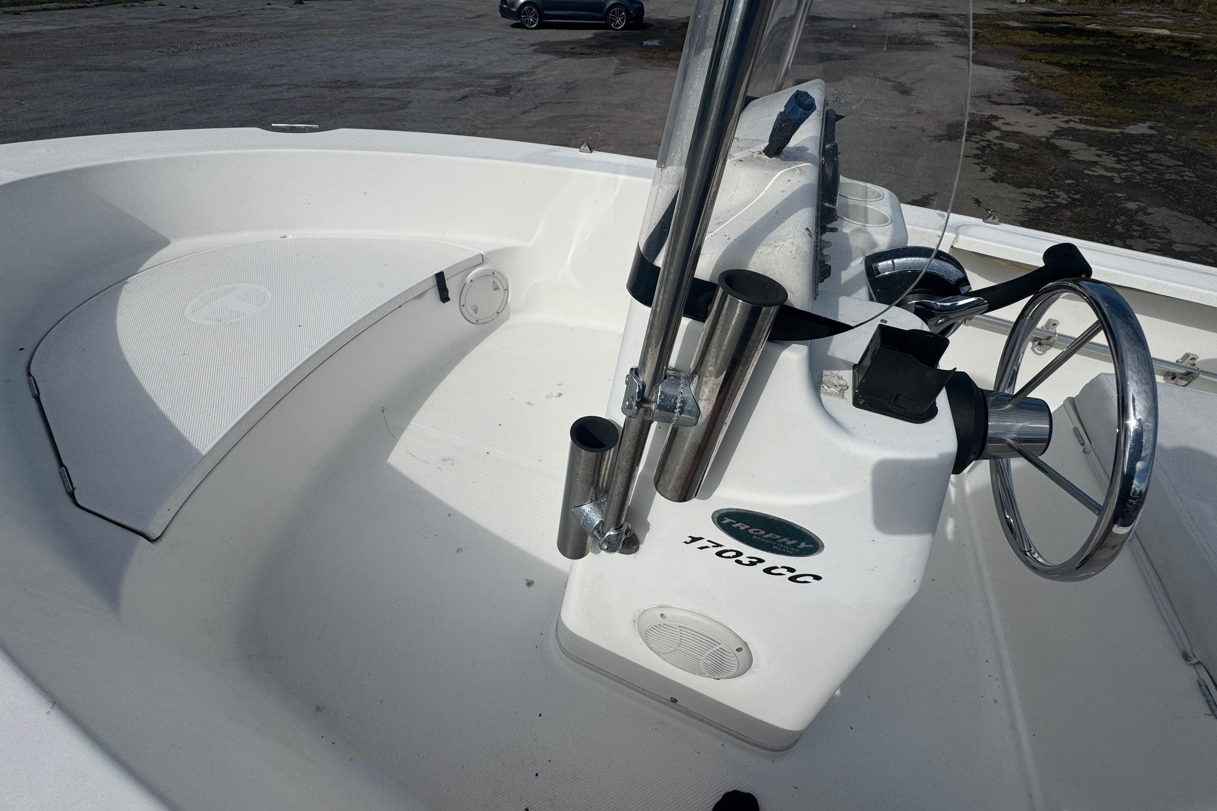 2007 Trophy 1703 Center Console boat interior with steering wheel and rod holders.