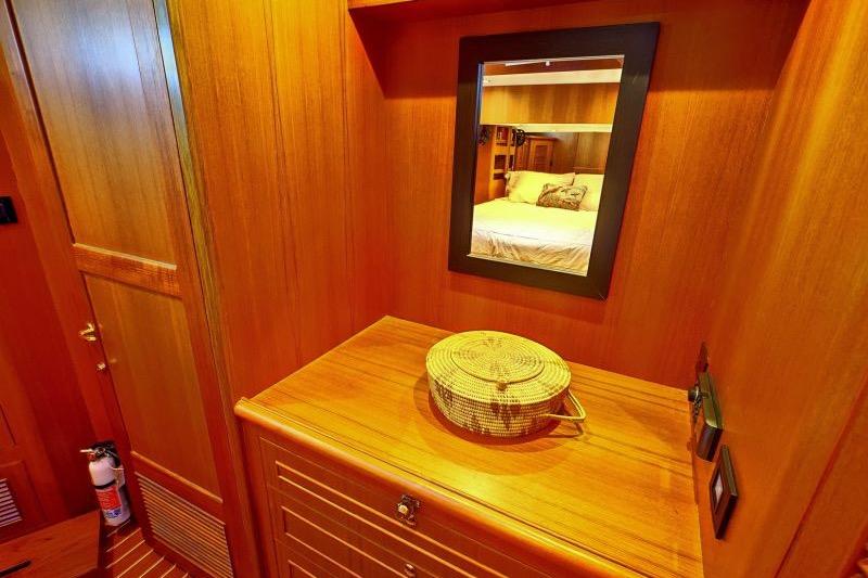 Luxurious wooden interior of 2016 North Pacific 45 Pilothouse yacht cabin.