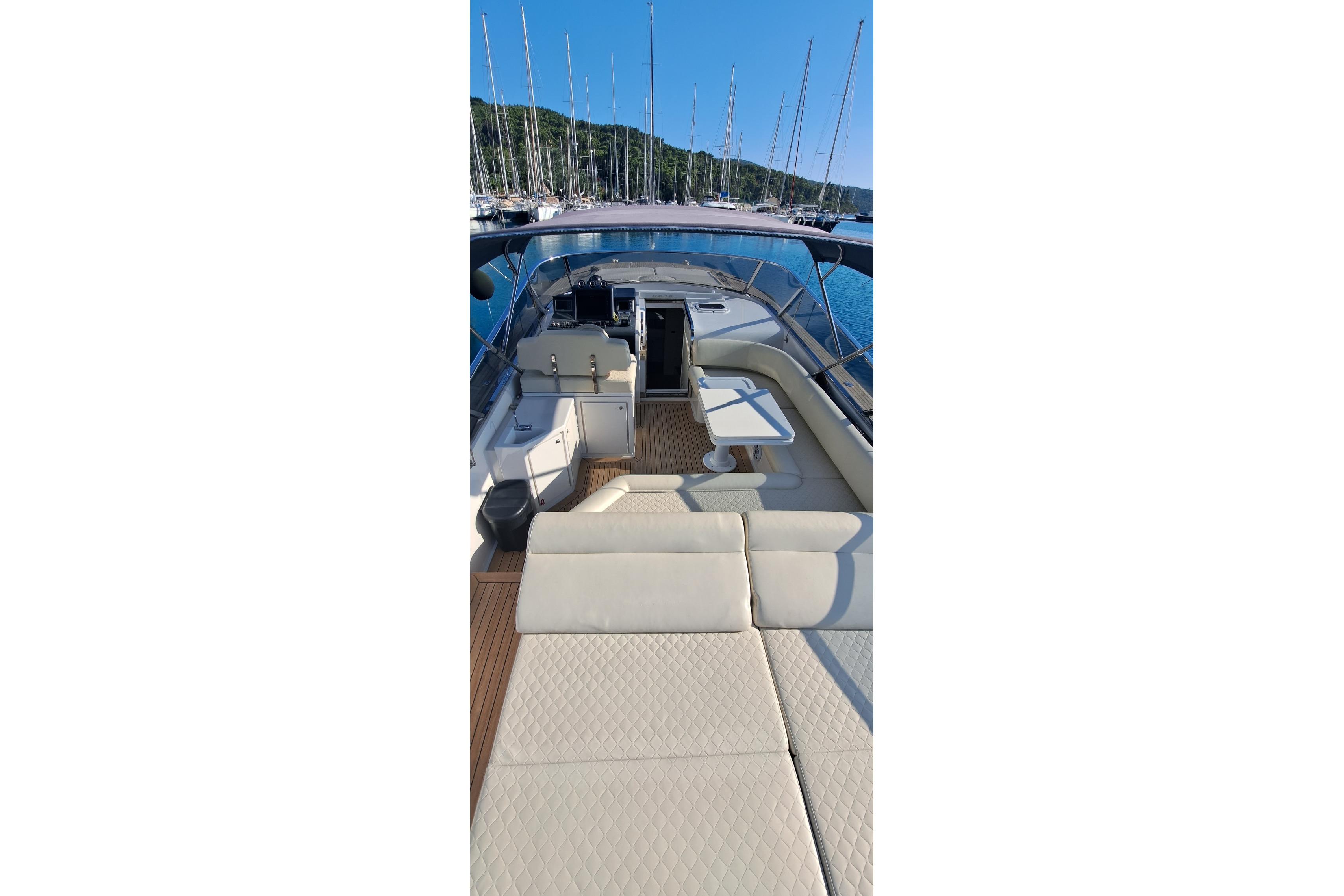 Luxurious 2016 Itama 45 yacht interior with elegant seating and sleek design.