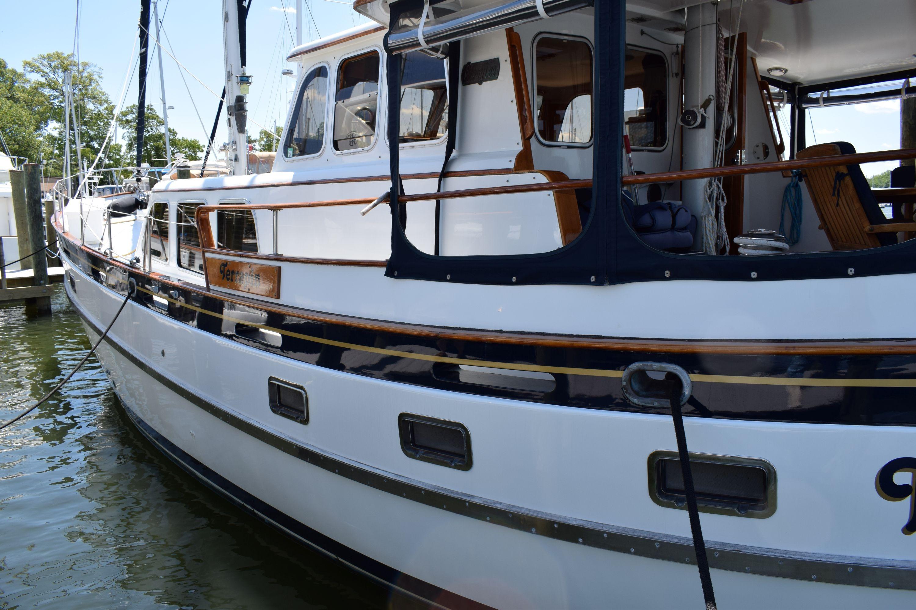 1980 Cheoy Lee 52 Motorsailer docked, showcasing elegant design and classic nautical features.