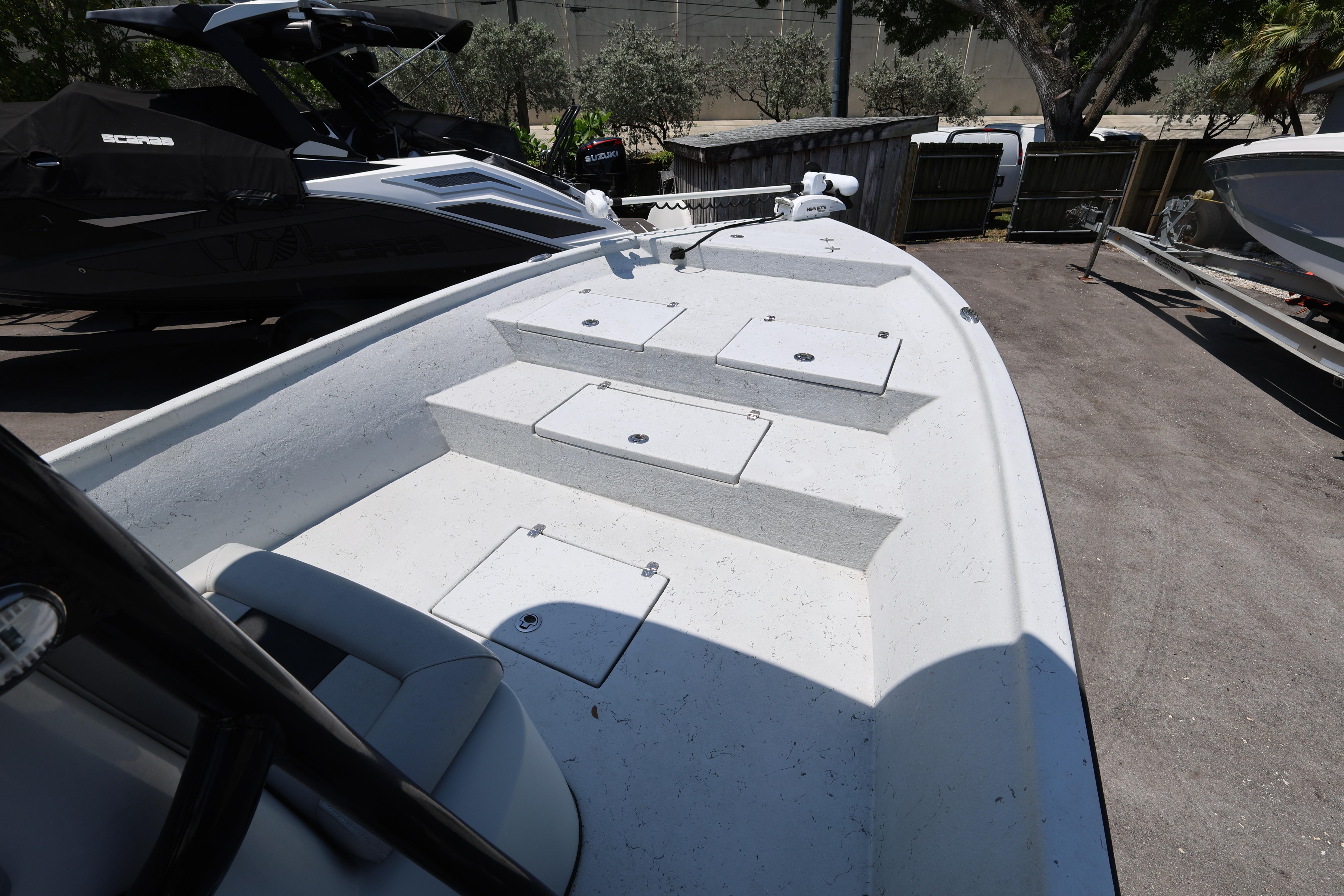2021 Blazer Bay 2400 boat deck with storage compartments, parked outdoors.