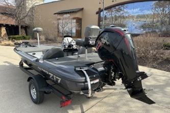 2026 Nitro Z17 boat with motor on trailer, parked outdoors.