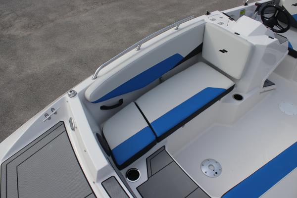 2025 Starcraft SV 16 OB boat interior with blue and white seating, modern design.