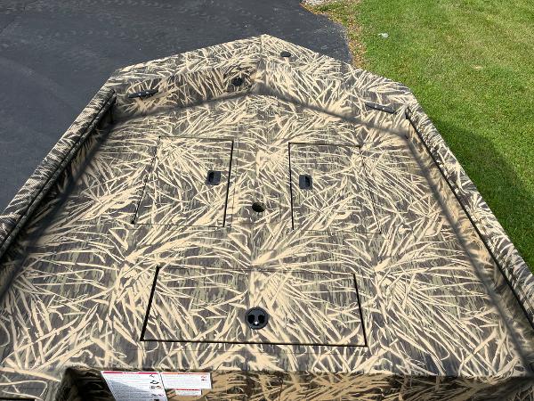 2024 Lowe Roughneck 1660 boat with camouflage pattern on deck.