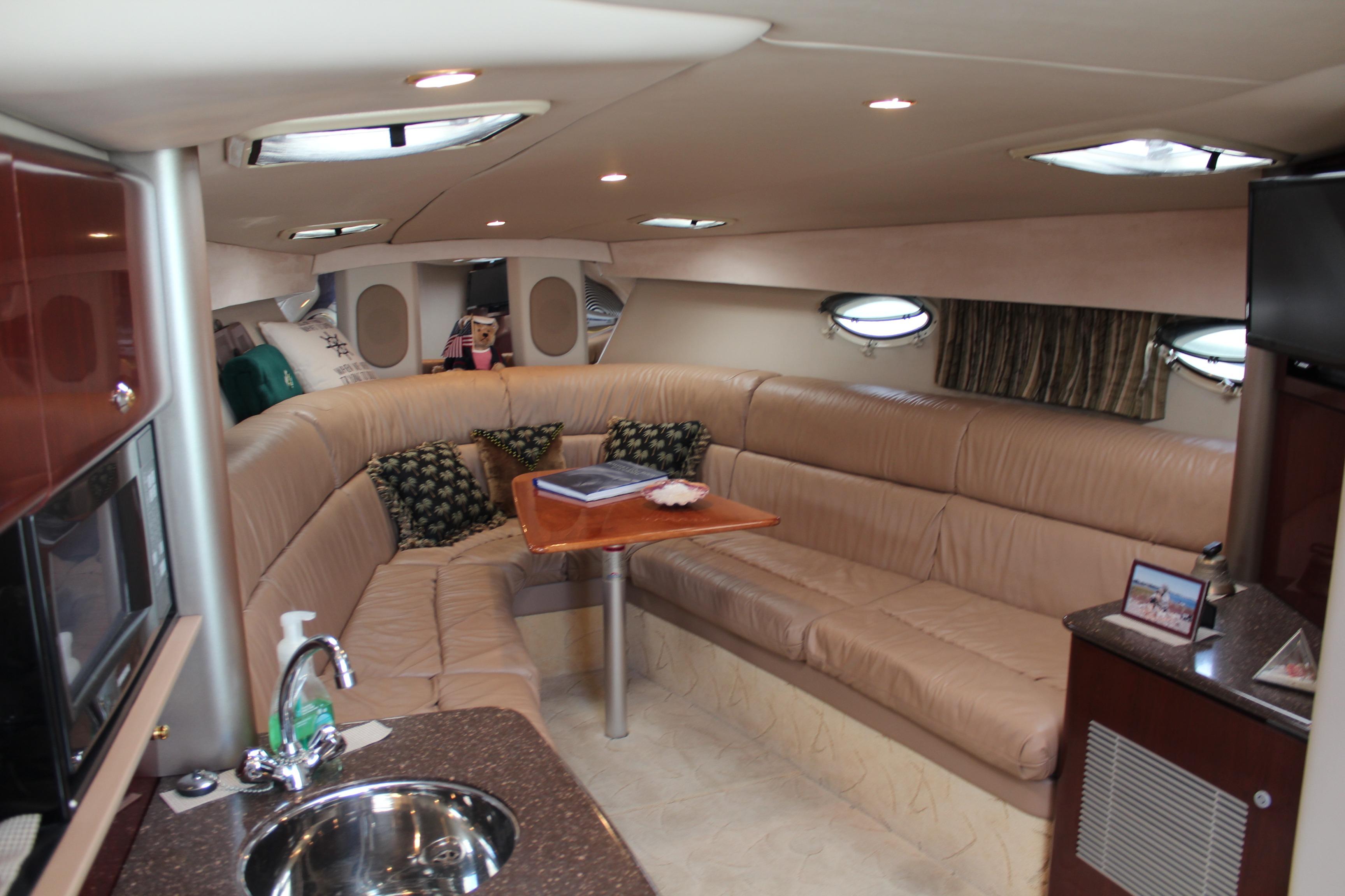 Luxurious interior of a 2003 Formula 370 Super Sport yacht with plush seating and modern amenities.