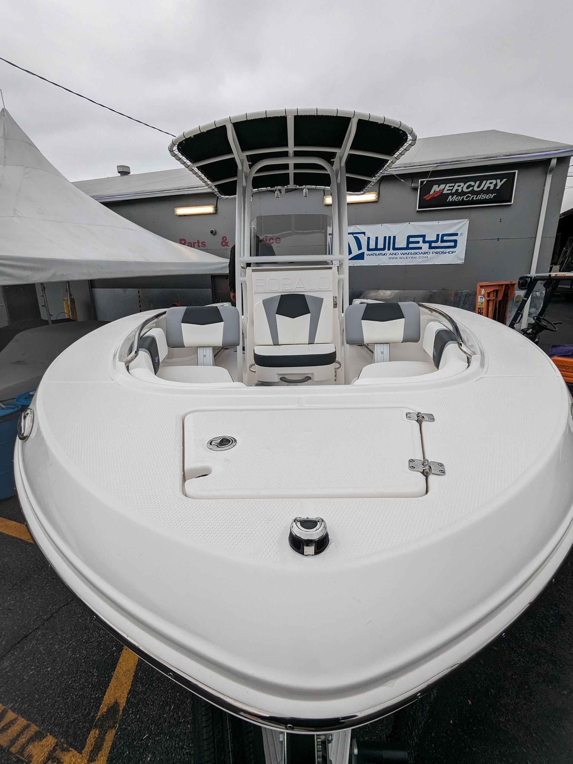 2024 Robalo R200 Center Console boat displayed at a dealership.