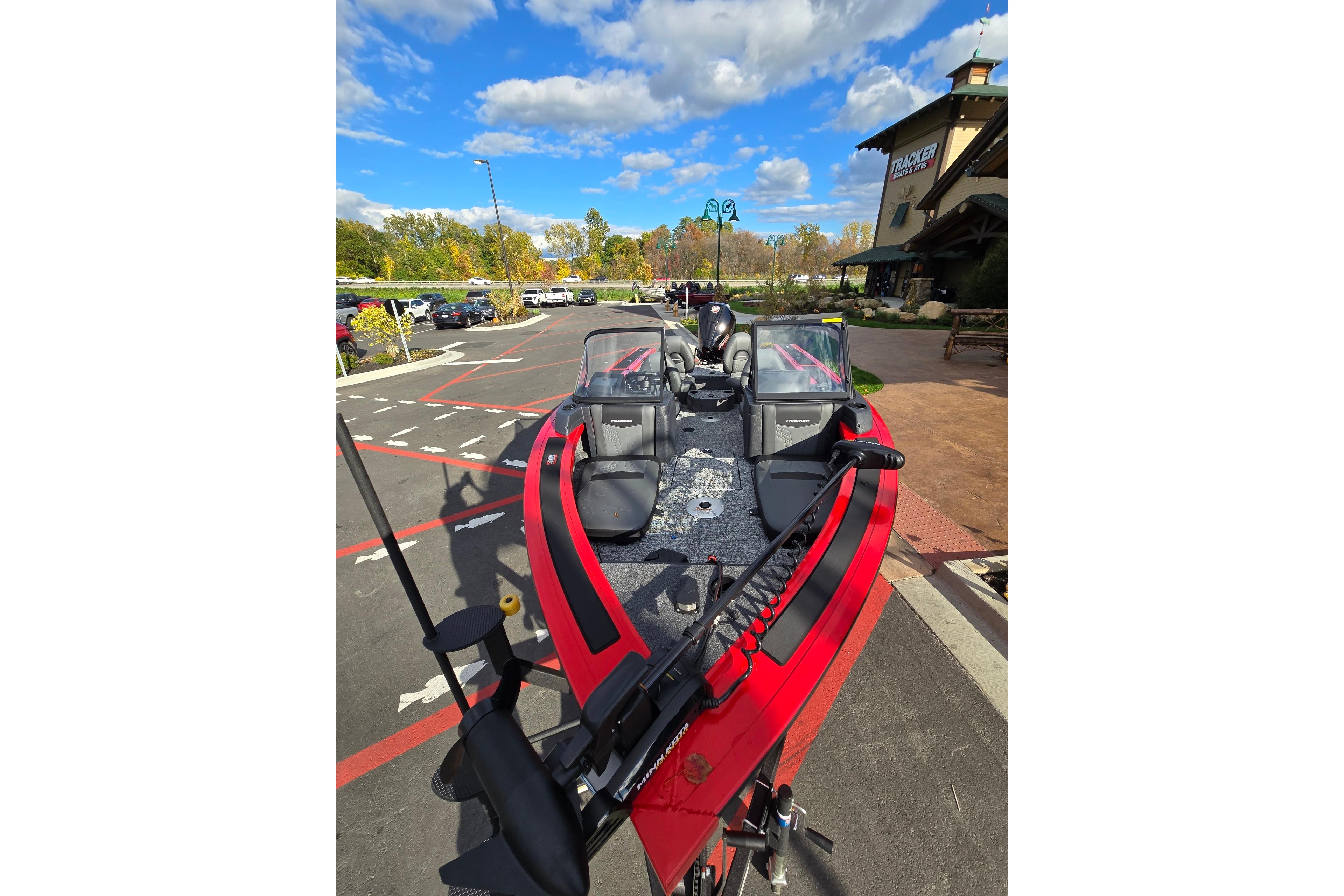 2026 Tracker Targa V-19 Combo boat parked outdoors under a blue sky.