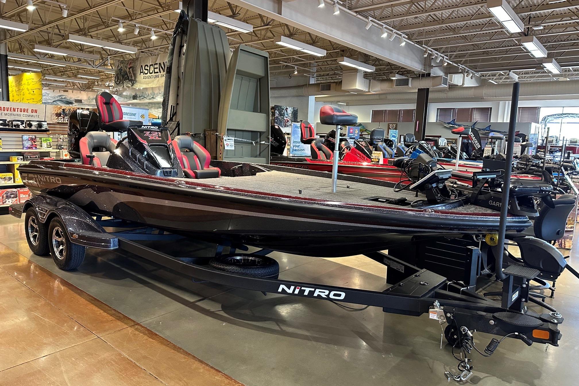 2026 Nitro Z21 XL Pro bass boat displayed in a showroom, featuring sleek design and modern amenities.